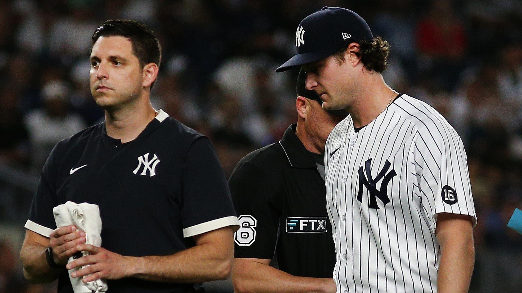 Sep 7, 2021; Bronx, New York, USA; New York Yankees starting pitcher Gerrit Cole (45) leaves the field with the trainer against the Toronto Blue Jays during the fourth inning at Yankee Stadium. Mandatory Credit: Andy Marlin-USA TODAY Sports / © Andy Marlin-USA TODAY Sports