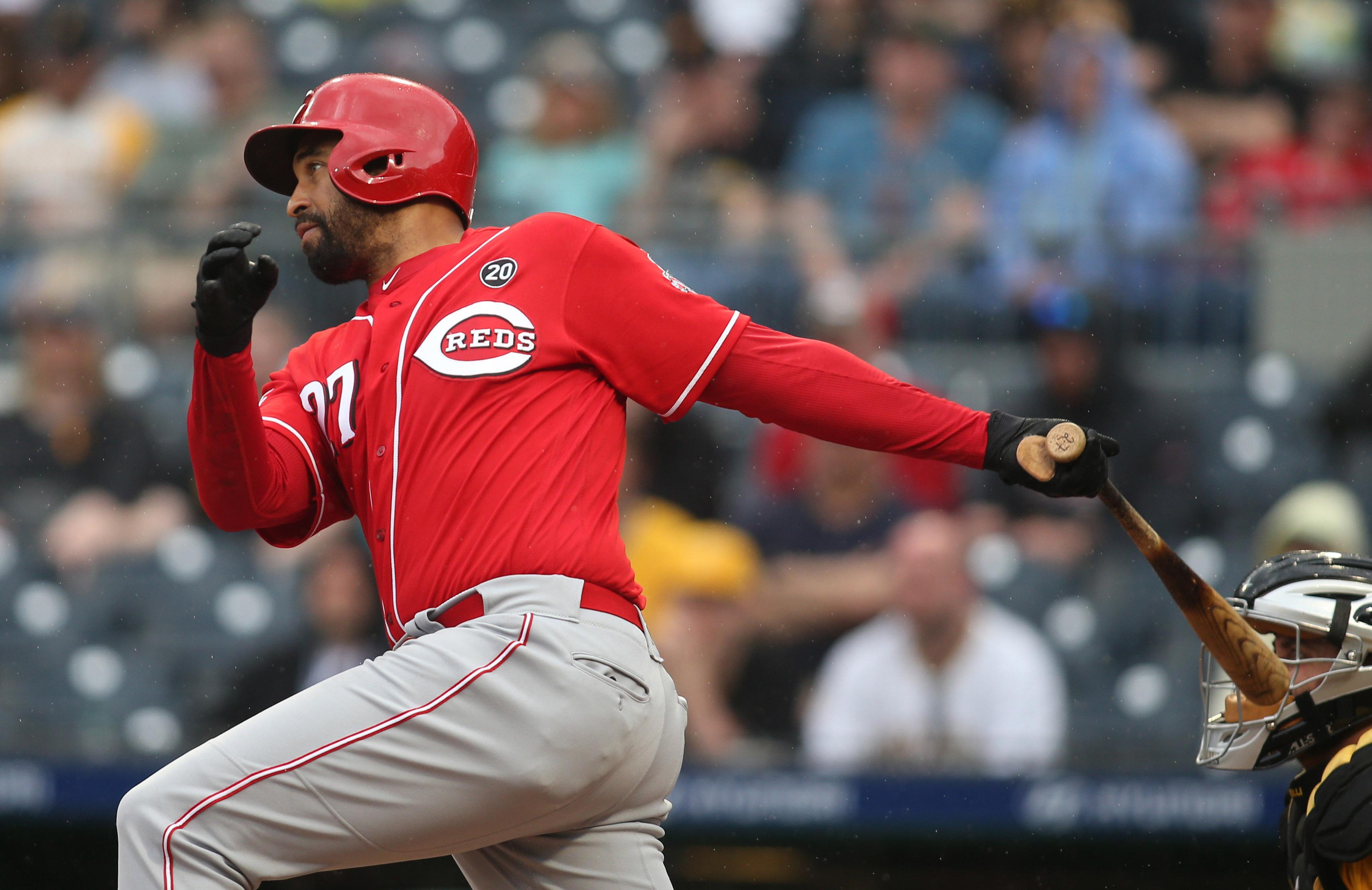 Apr 7, 2019; Pittsburgh, PA, USA; Cincinnati Reds left fielder Matt Kemp (27) singles against the Pittsburgh Pirates during the seventh inning at PNC Park. The Pirates won 7-5. Mandatory Credit: Charles LeClaire-USA TODAY Sports