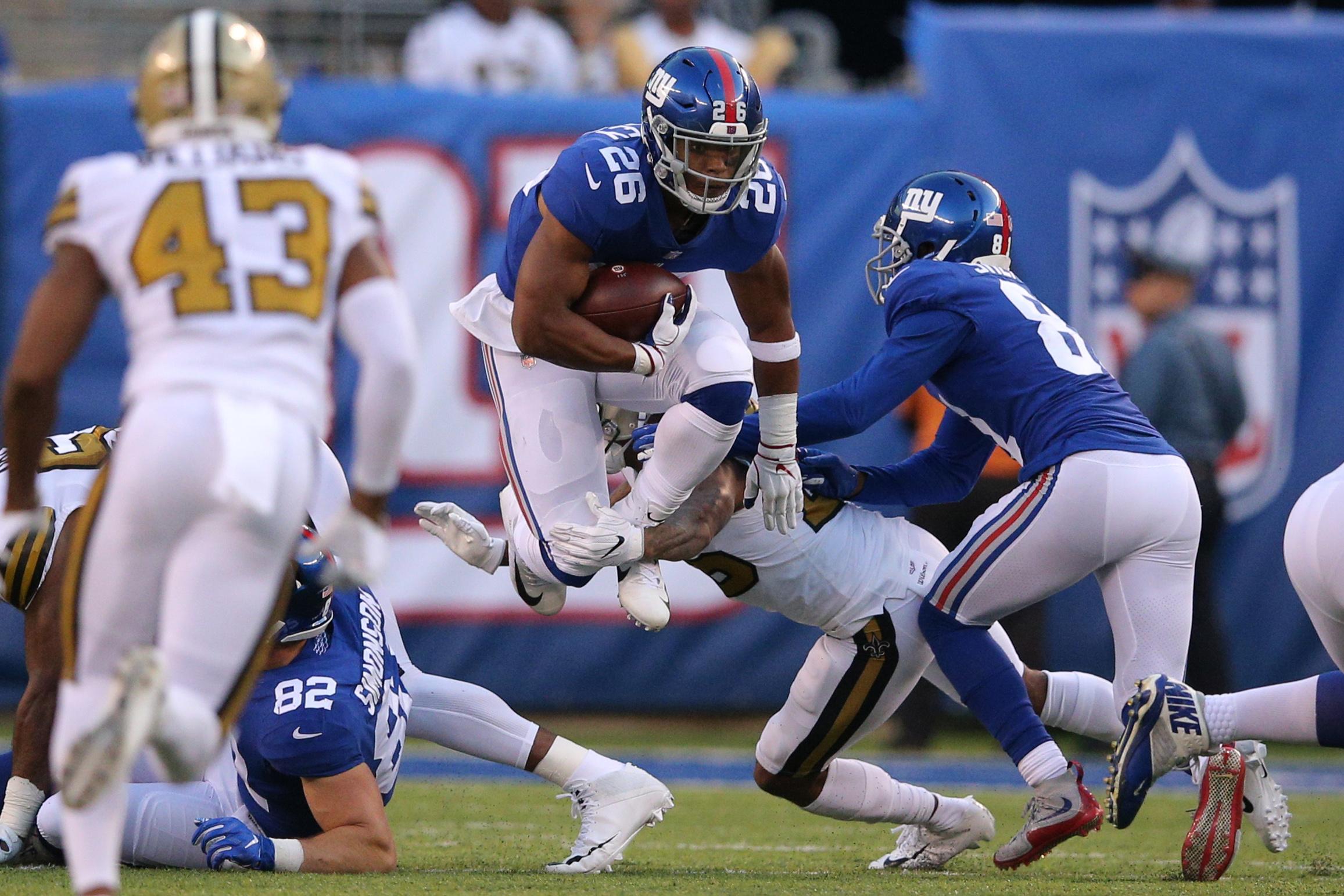 Sep 30, 2018; East Rutherford, NJ, USA; New York Giants running back Saquon Barkley (26) runs the ball against the New Orleans Saints during the third quarter at MetLife Stadium. Mandatory Credit: Brad Penner-USA TODAY Sports