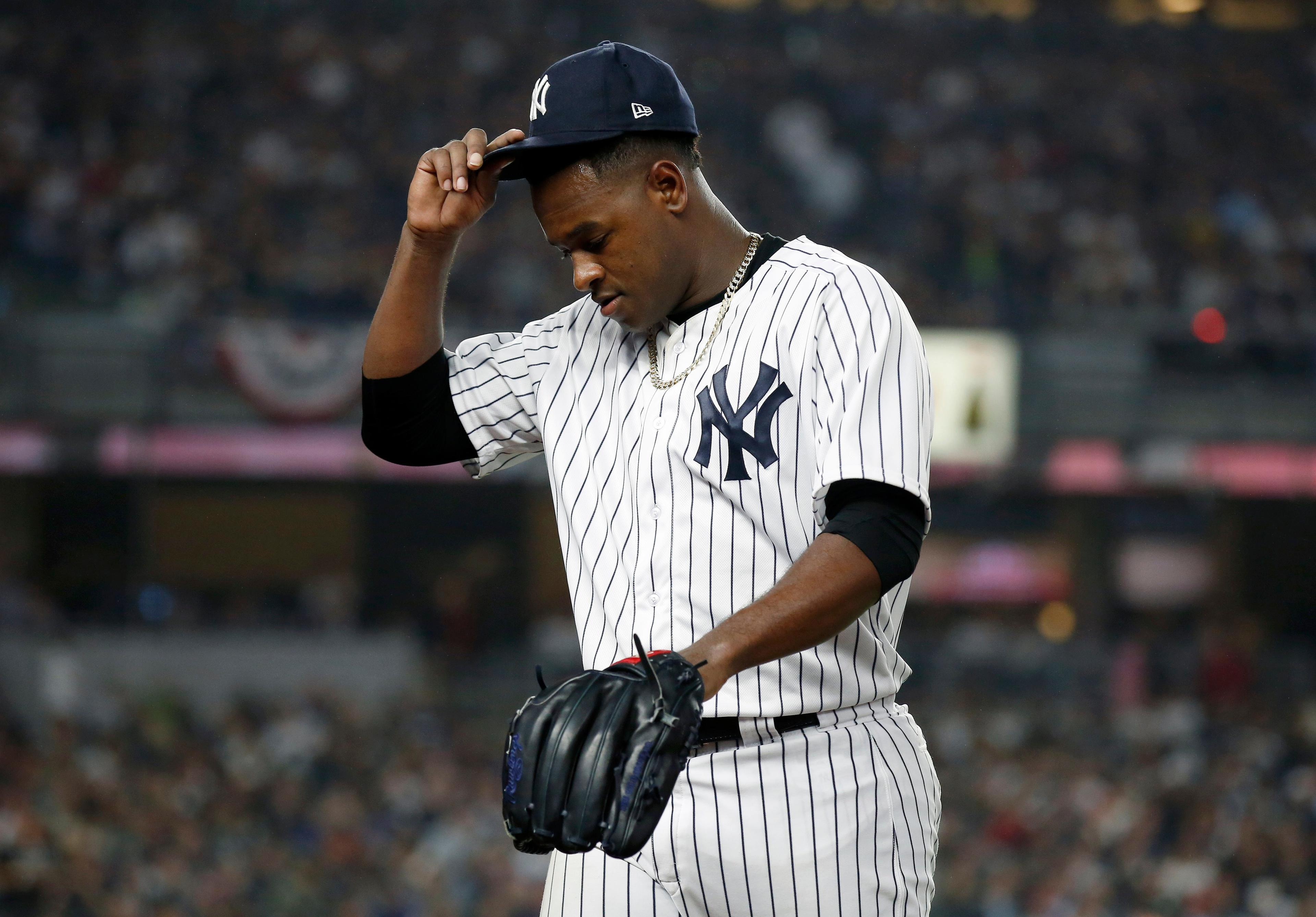 Oct 8, 2018; Bronx, NY, USA; New York Yankees starting pitcher Luis Severino (40) reacts after being relieved in the fourth inning against the Boston Red Sox in game three of the 2018 ALDS playoff baseball series at Yankee Stadium. Mandatory Credit: Adam Hunger-USA TODAY Sports