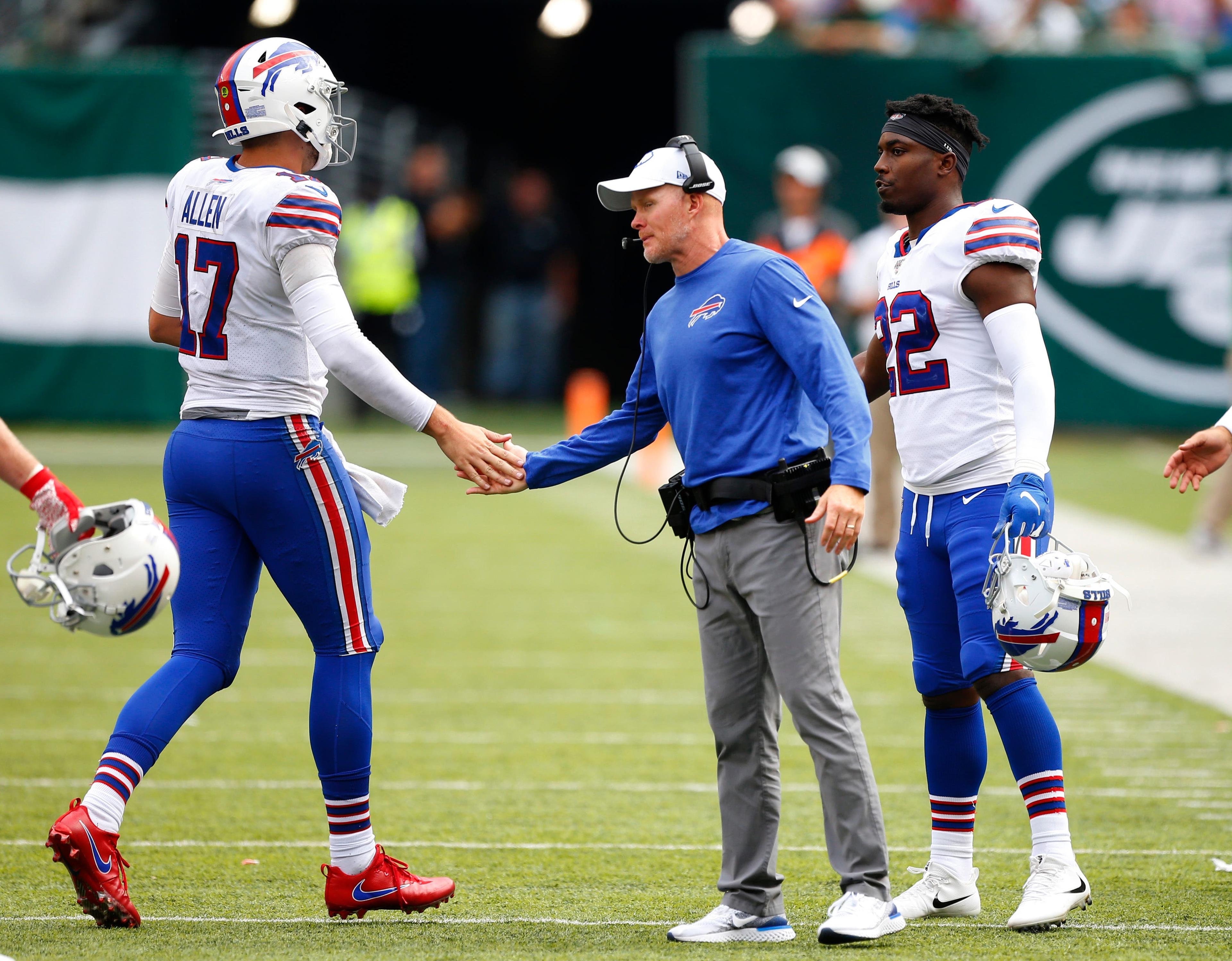 Sep 8, 2019; East Rutherford, NJ, USA; Buffalo Bills quarterback Josh Allen (17) shakes hands with head coach Sean McDermott after scoring a touchdown against the New York Jets during the second half at MetLife Stadium. Mandatory Credit: Noah K. Murray-USA TODAY Sports / Noah K. Murray