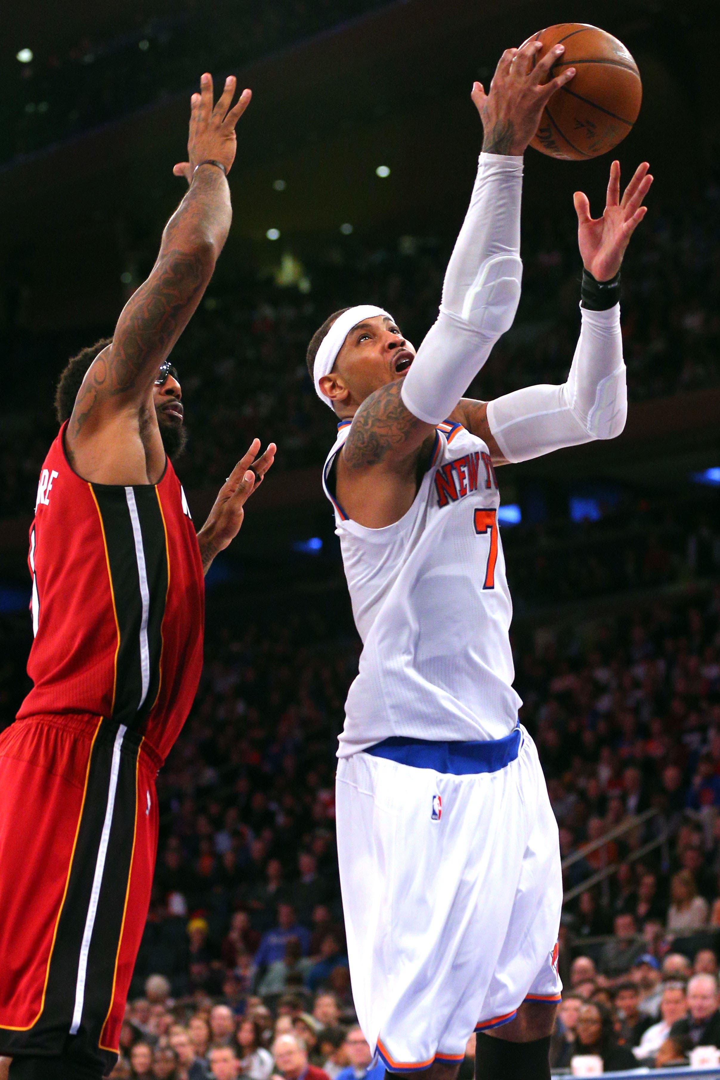 Feb 28, 2016; New York, NY, USA; New York Knicks small forward Carmelo Anthony (7) drives against Miami Heat power forward Amar'e Stoudemire (5) during the fourth quarter at Madison Square Garden. Mandatory Credit: Brad Penner-USA TODAY Sports / Brad Penner