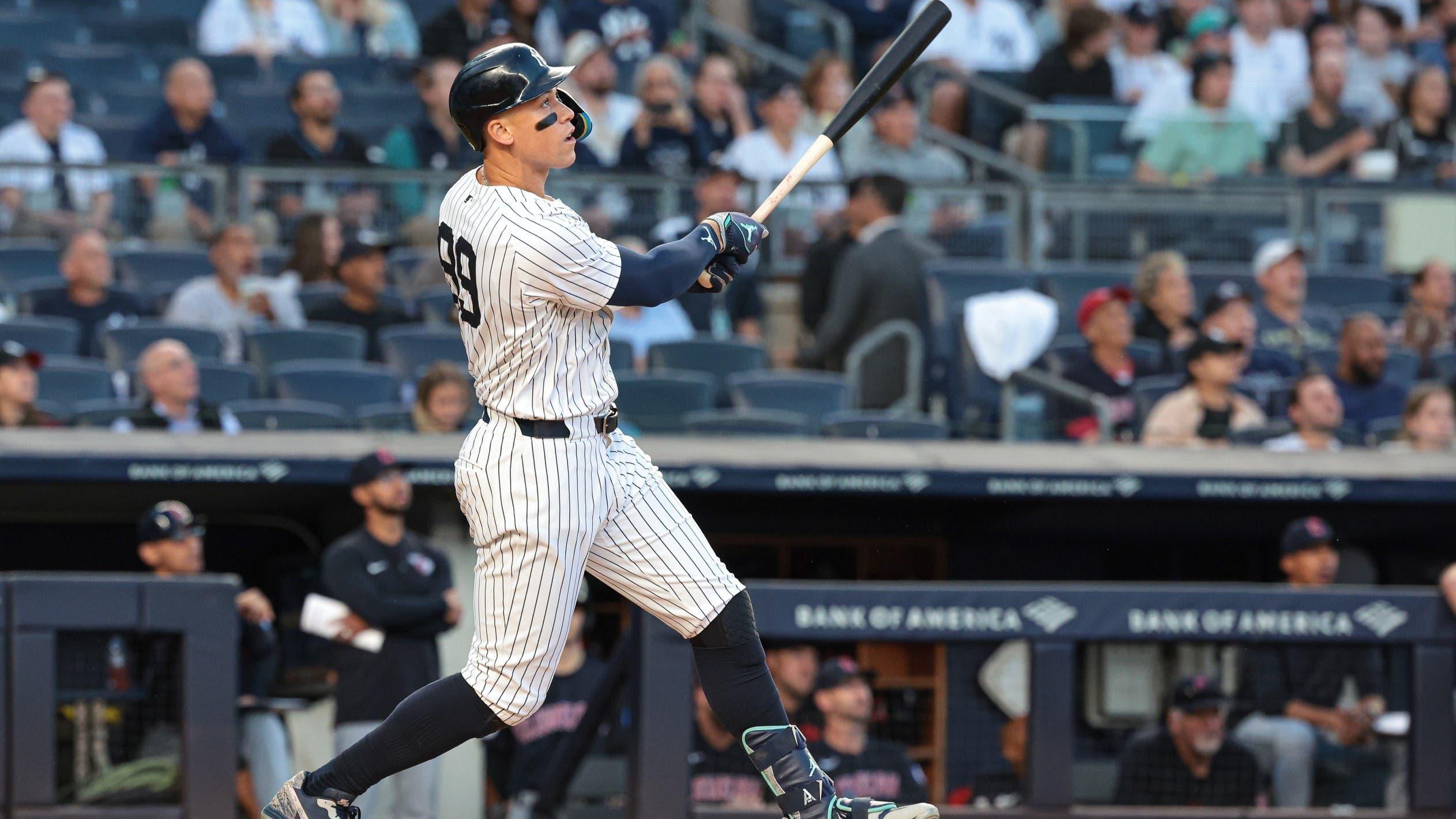 Aug 20, 2024; Bronx, New York, USA; New York Yankees center fielder Aaron Judge (99) hits a solo home run during the first inning against the Cleveland Guardians at Yankee Stadium. / Vincent Carchietta-USA TODAY Sports