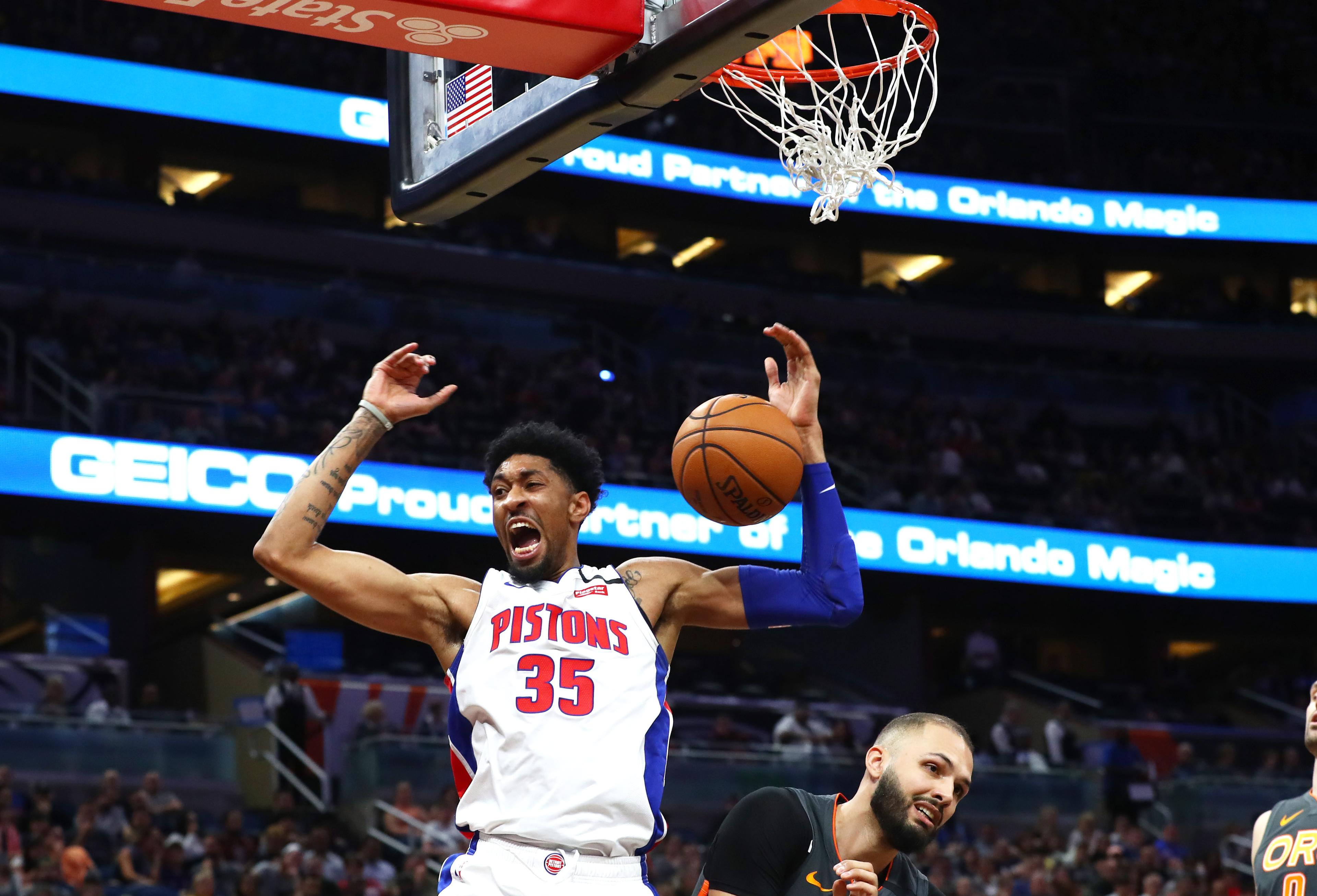 Feb 12, 2020; Orlando, Florida, USA; Detroit Pistons forward Christian Wood (35) reacts as he dunks over Orlando Magic guard Evan Fournier (10) during the first half at Amway Center. Mandatory Credit: Kim Klement-USA TODAY Sports