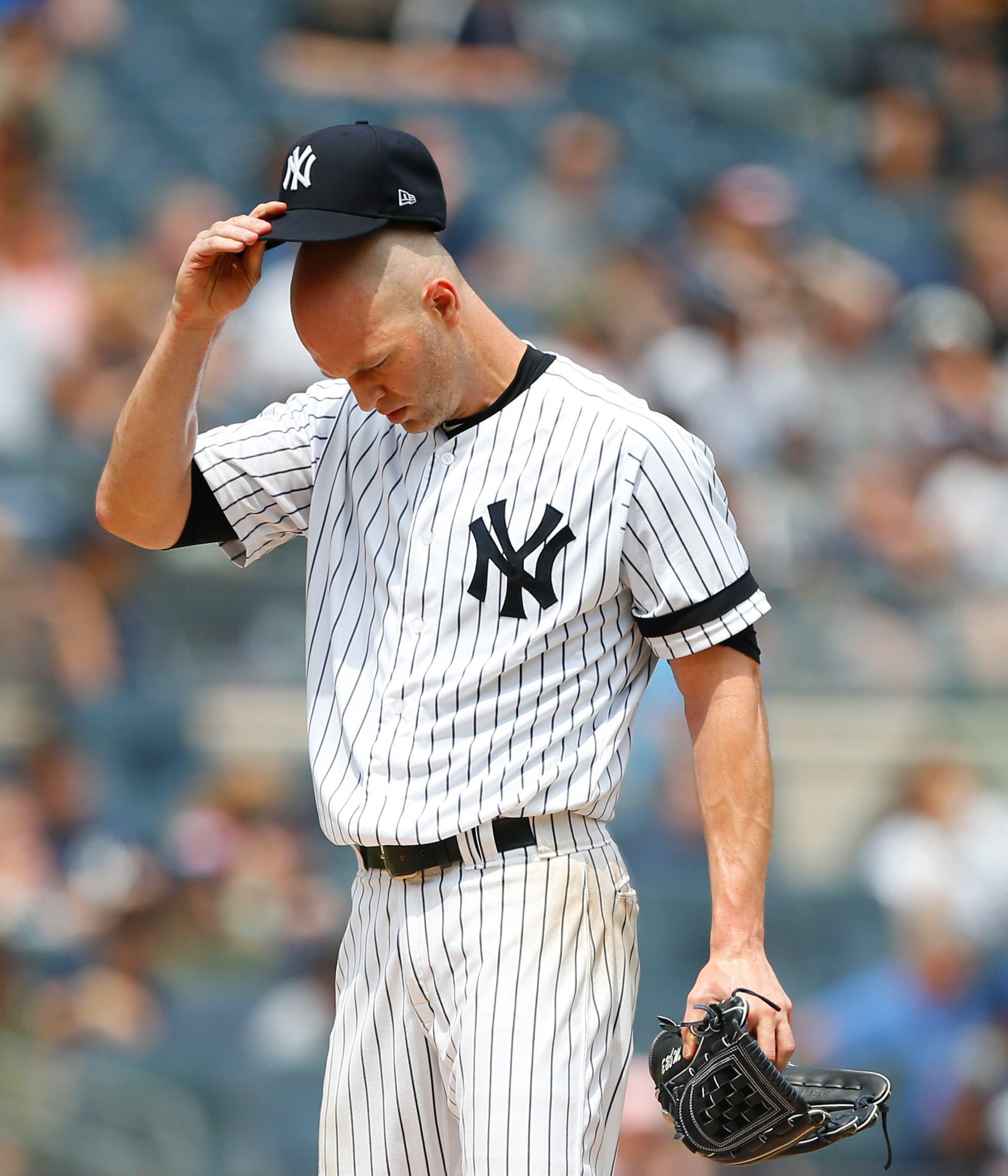 Aug 14, 2019; Bronx, NY, USA; New York Yankees starting pitcher J.A. Happ (34) pauses before pitching against the Baltimore Orioles in the first inning at Yankee Stadium. Mandatory Credit: Noah K. Murray-USA TODAY Sports / Noah K. Murray