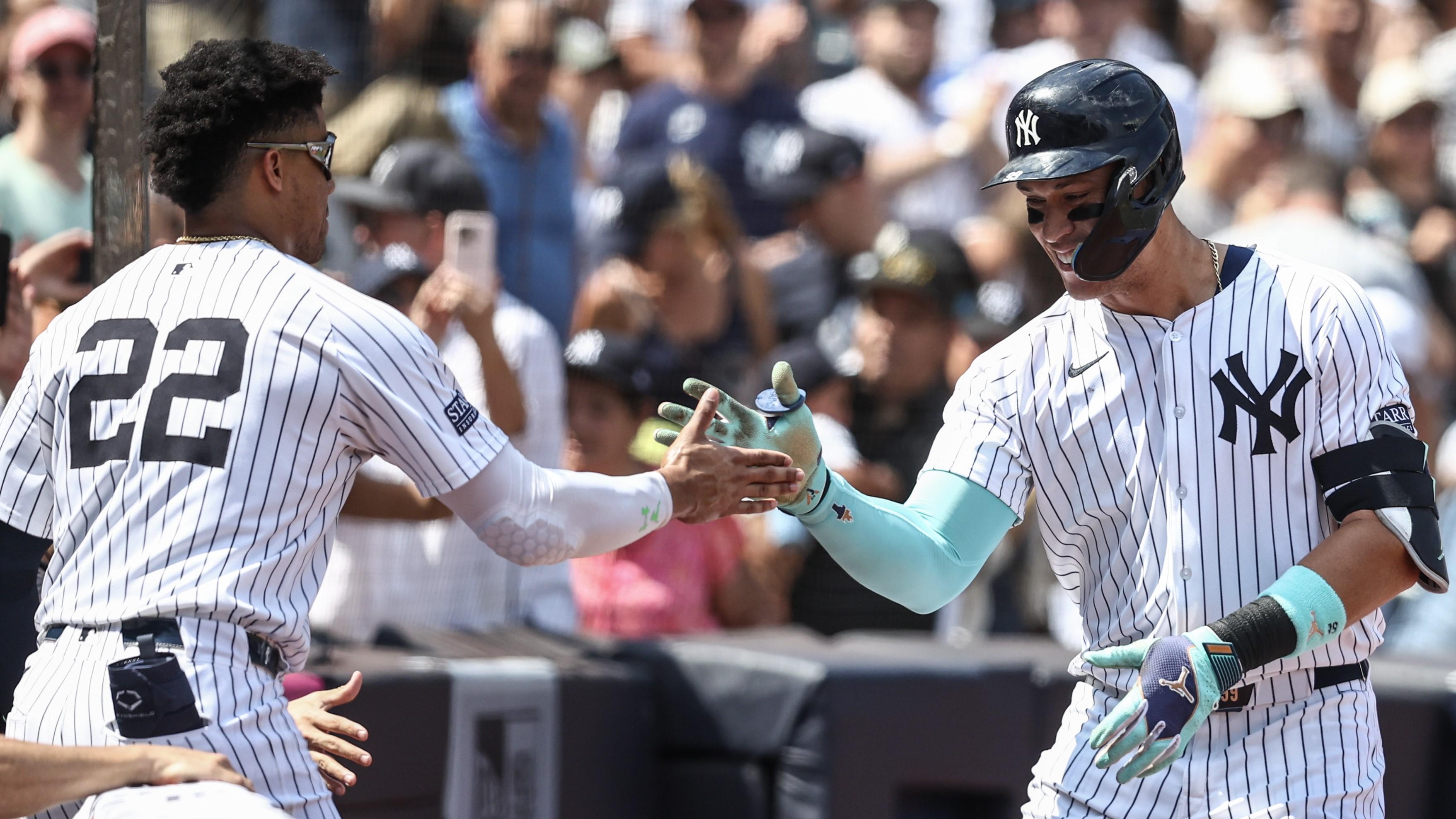 Aug 25, 2024; Bronx, New York, USA; New York Yankees center fielder Aaron Judge (99) celebrates with right fielder Juan Soto (22) after hitting a two run home run in the first inning against the Colorado Rockies at Yankee Stadium. Mandatory Credit: Wendell Cruz-USA TODAY Sports