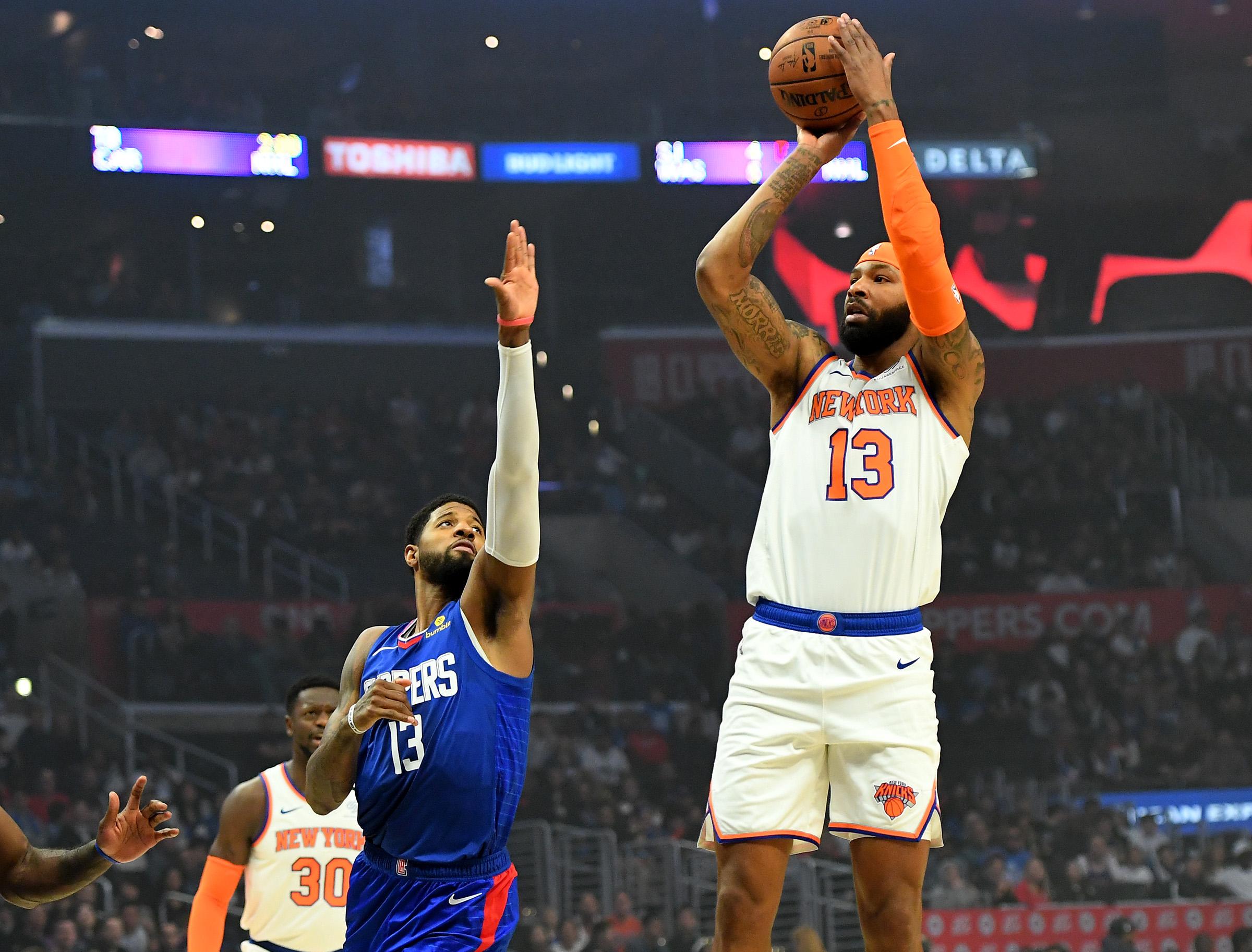 Jan 5, 2020; Los Angeles, California, USA; Los Angeles Clippers forward Paul George (13) defends a shot by New York Knicks forward Marcus Morris Sr. (13) in the first quarter of the game at Staples Center. Mandatory Credit: Jayne Kamin-Oncea-USA TODAY Sports