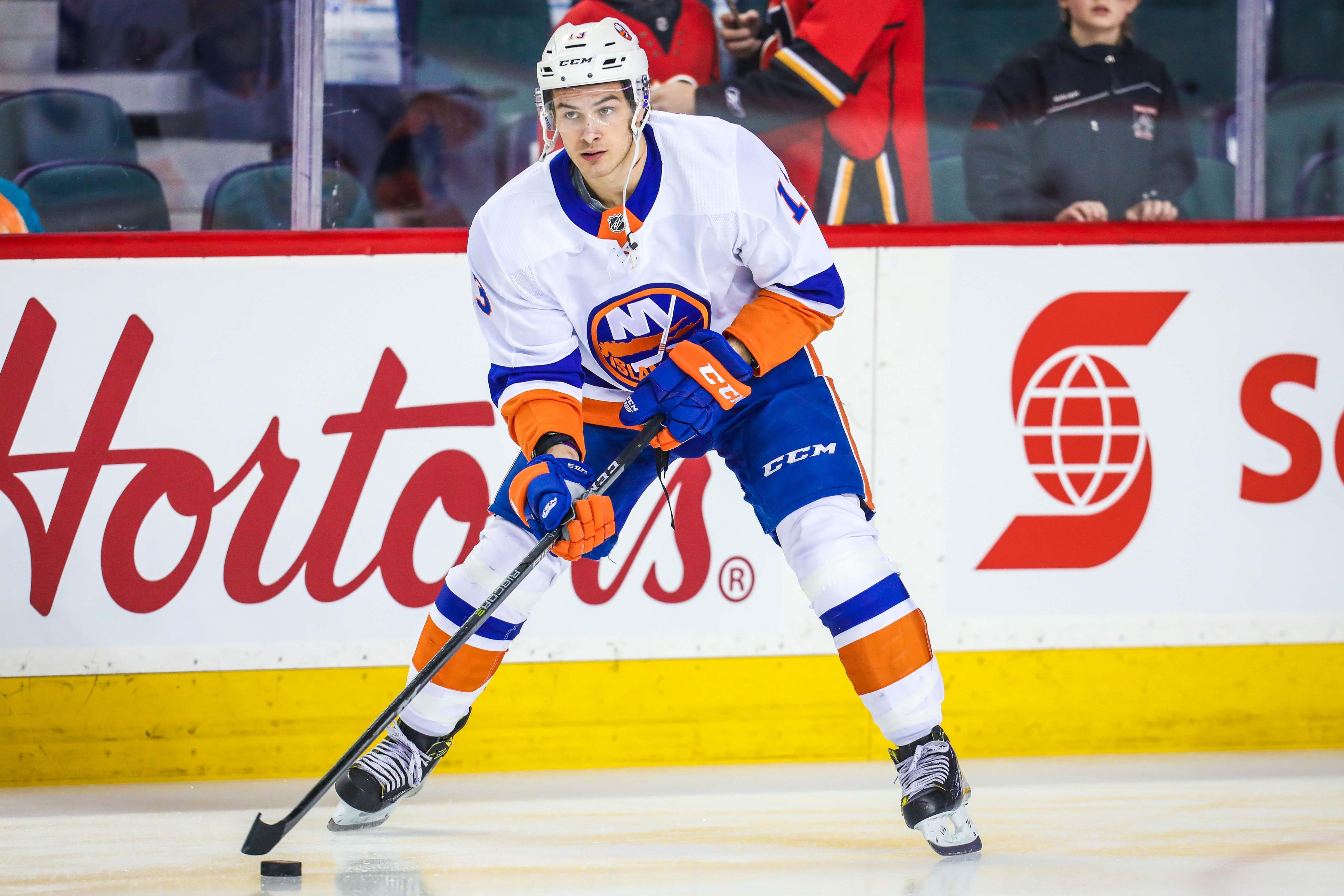 Mar 11, 2018; Calgary, Alberta, CAN; New York Islanders center Mathew Barzal (13) controls the puck during the warmup period against the Calgary Flames at Scotiabank Saddledome. Mandatory Credit: Sergei Belski-USA TODAY Sports / Sergei Belski