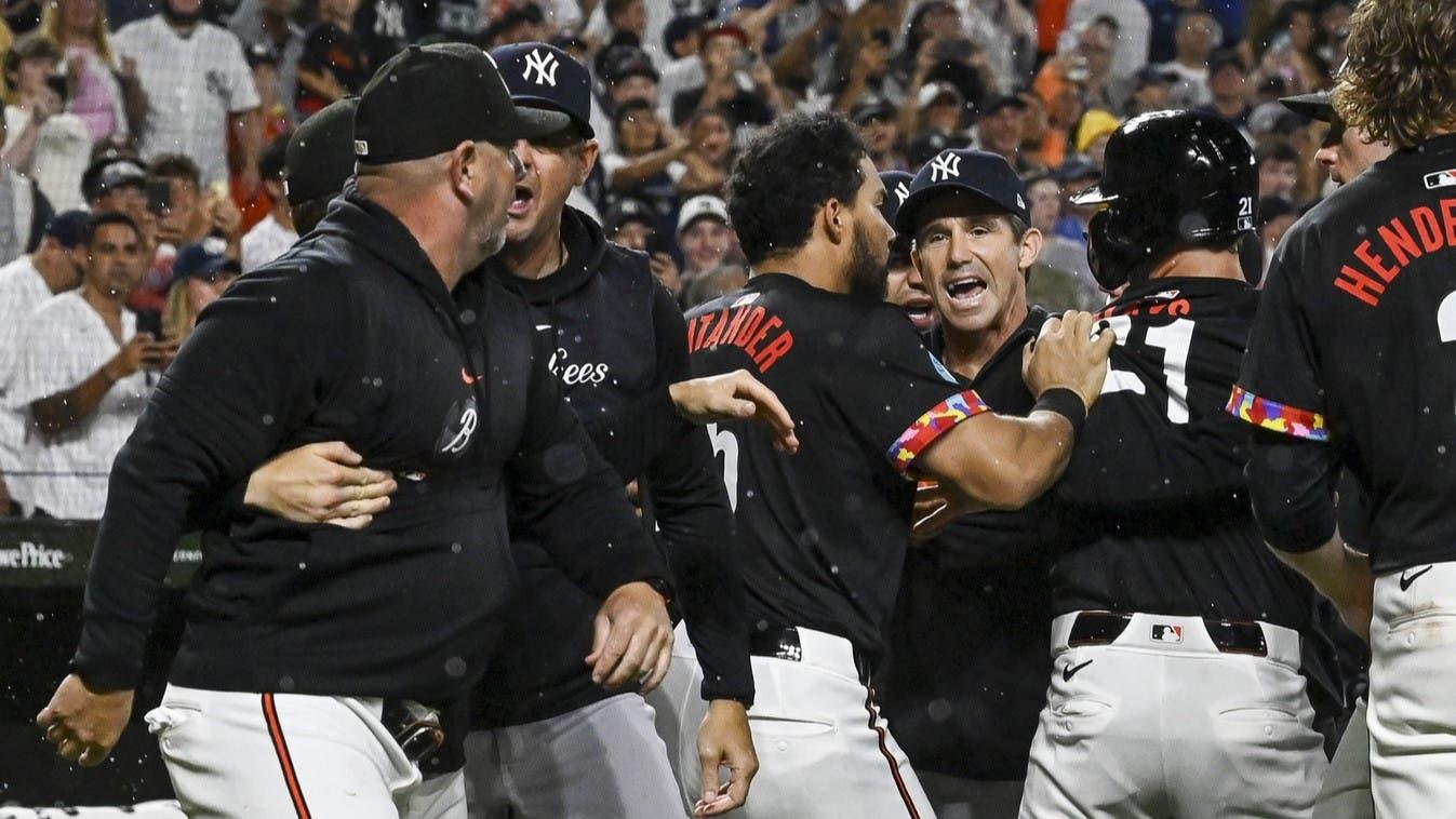 Jul 12, 2024; Baltimore, Maryland, USA; New York Yankees bench coach Brad Ausmus (68) and Baltimore Orioles manager Brandon Hyde (18) exchange words during the ninth inning at Oriole Park at Camden Yards. / Tommy Gilligan-USA TODAY Sports