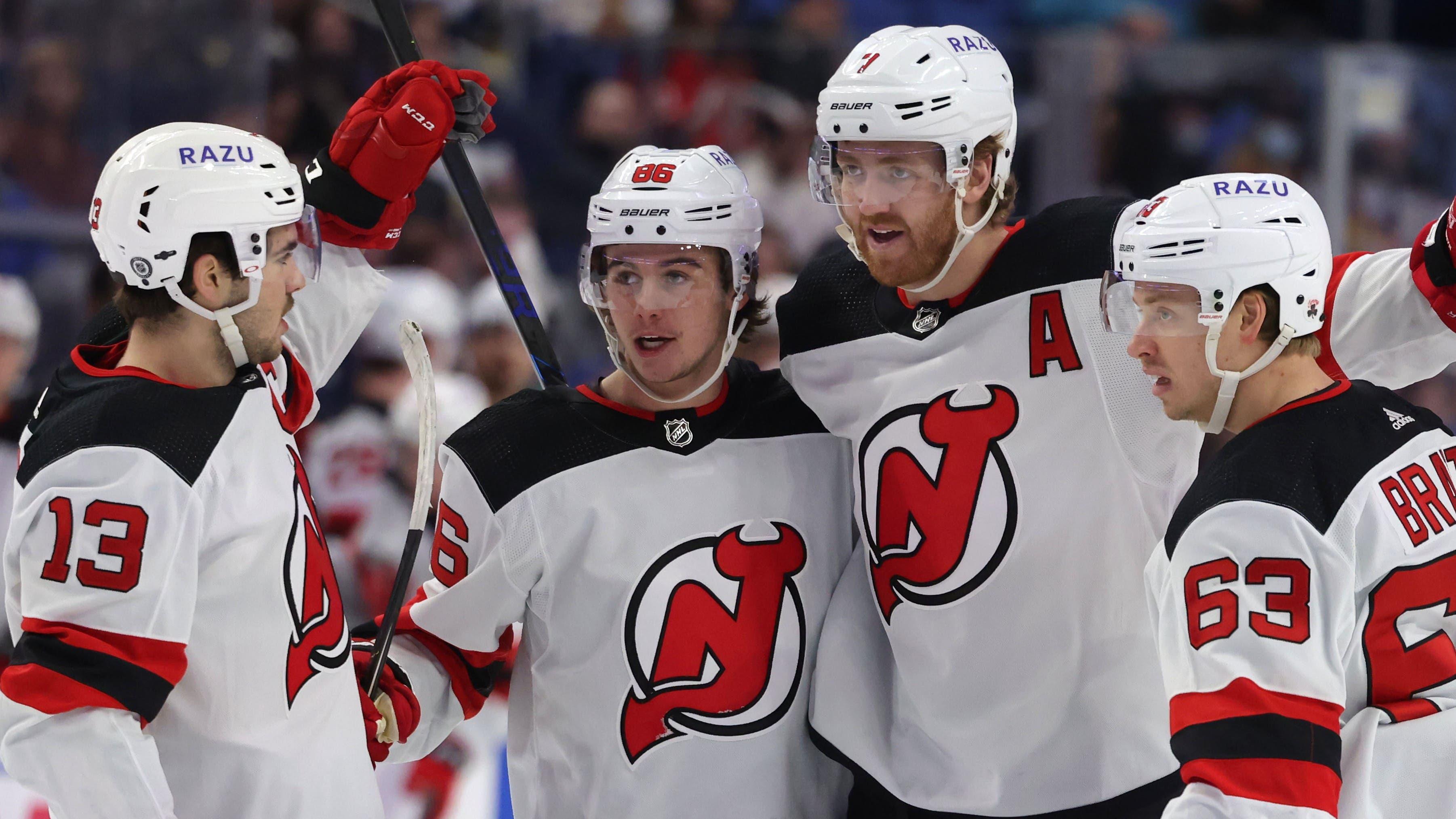 Dec 29, 2021; Buffalo, New York, USA; New Jersey Devils defenseman Dougie Hamilton (7) celebrates his goal with teammates during the first period against the Buffalo Sabres at KeyBank Center. Mandatory Credit: Timothy T. Ludwig-USA TODAY Sports / Timothy T. Ludwig-USA TODAY Sports