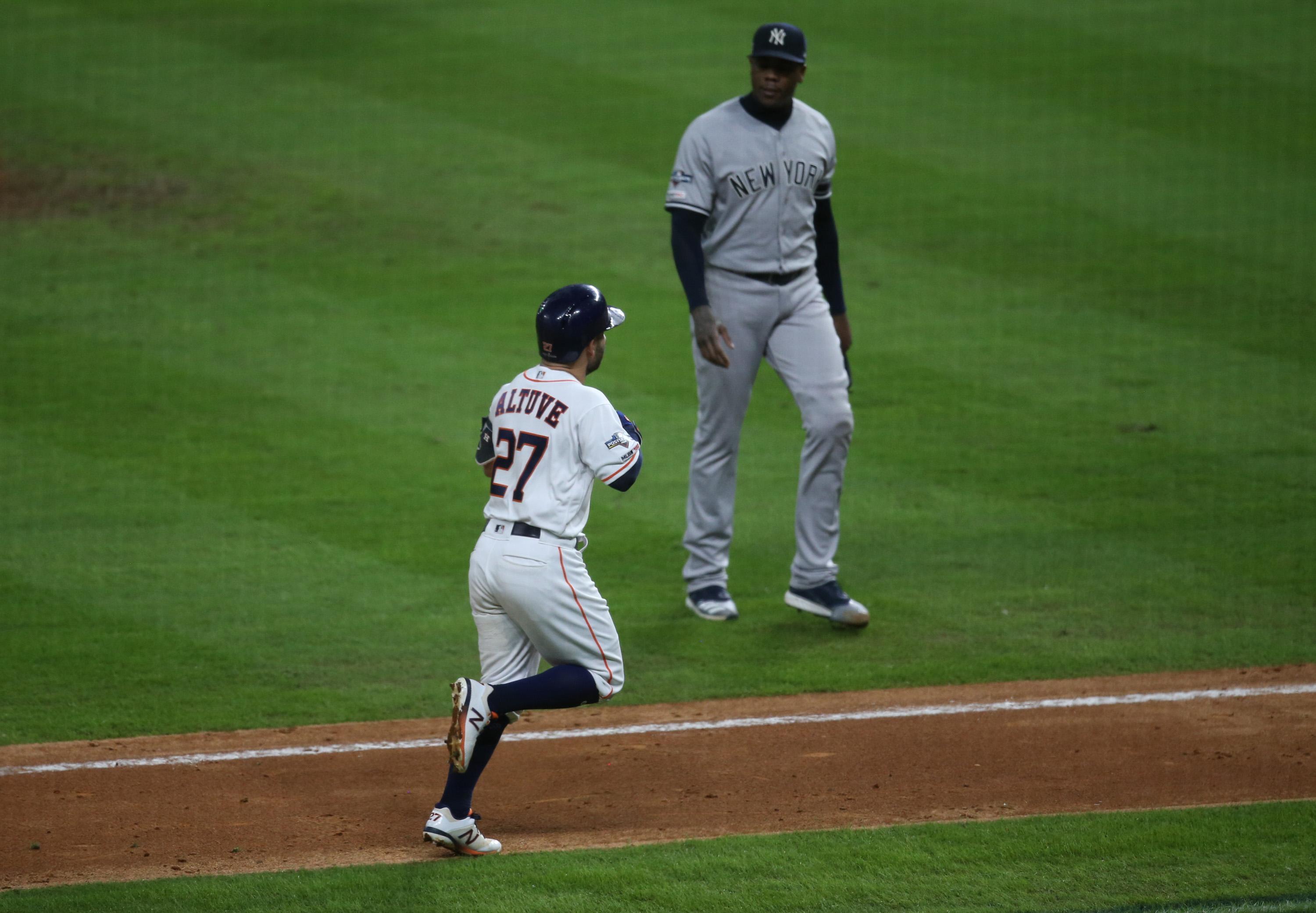 Oct 19, 2019; Houston, TX, USA; Houston Astros second baseman Jose Altuve (27) rounds the bases after hitting a game winning home run off of New York Yankees relief pitcher Aroldis Chapman (54) against the New York Yankees in game six of the 2019 ALCSS playoff baseball series at Minute Maid Park. Mandatory Credit: Thomas B. Shea-USA TODAY Sports