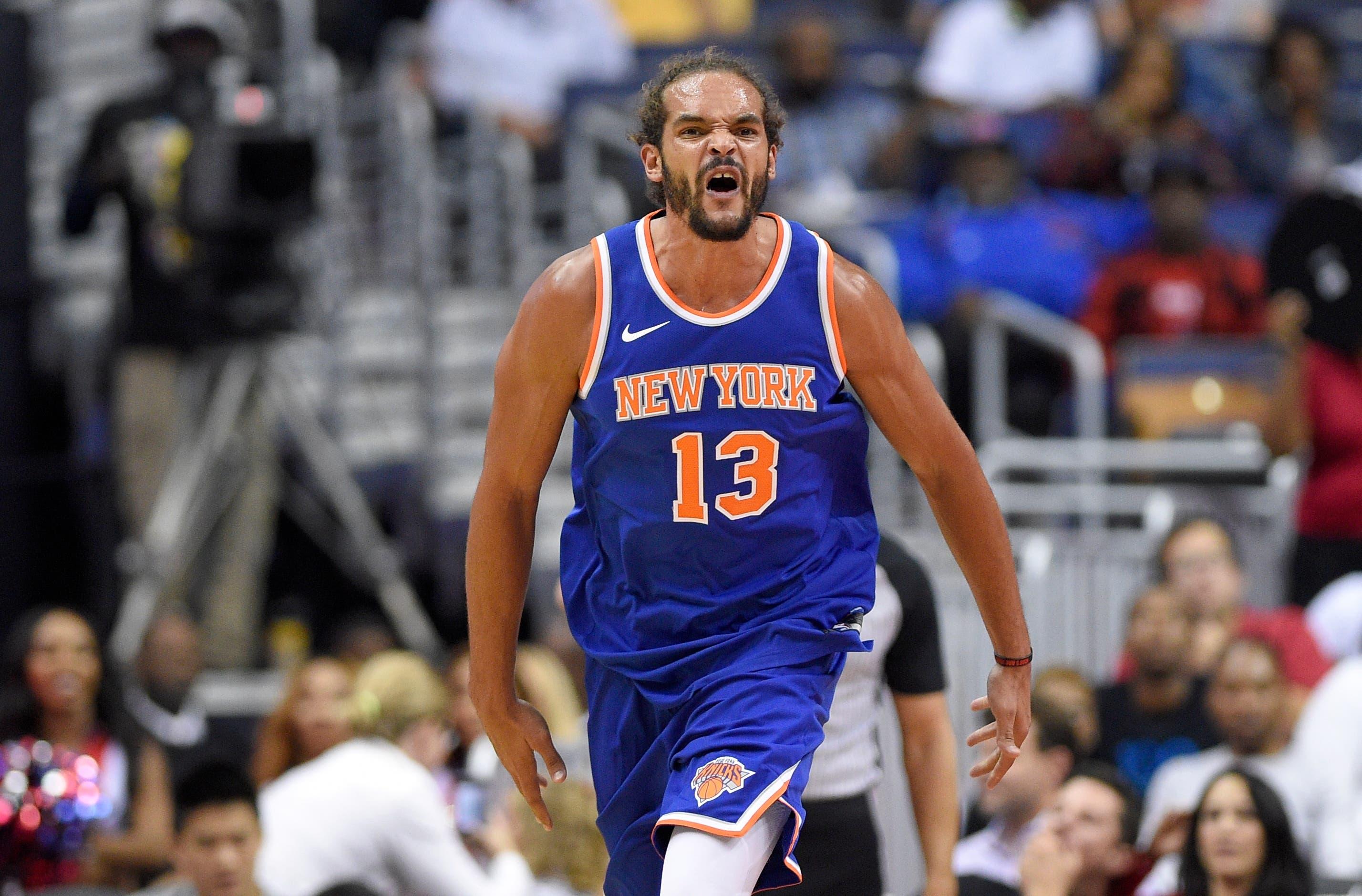 New York Knicks center Joakim Noah (13) reacts during the second half of a preseason NBA basketball game against the Washington Wizards, Friday, Oct. 6, 2017, in Washington. The Wizards won 104-100. (AP Photo/Nick Wass) / Nick Wass/AP