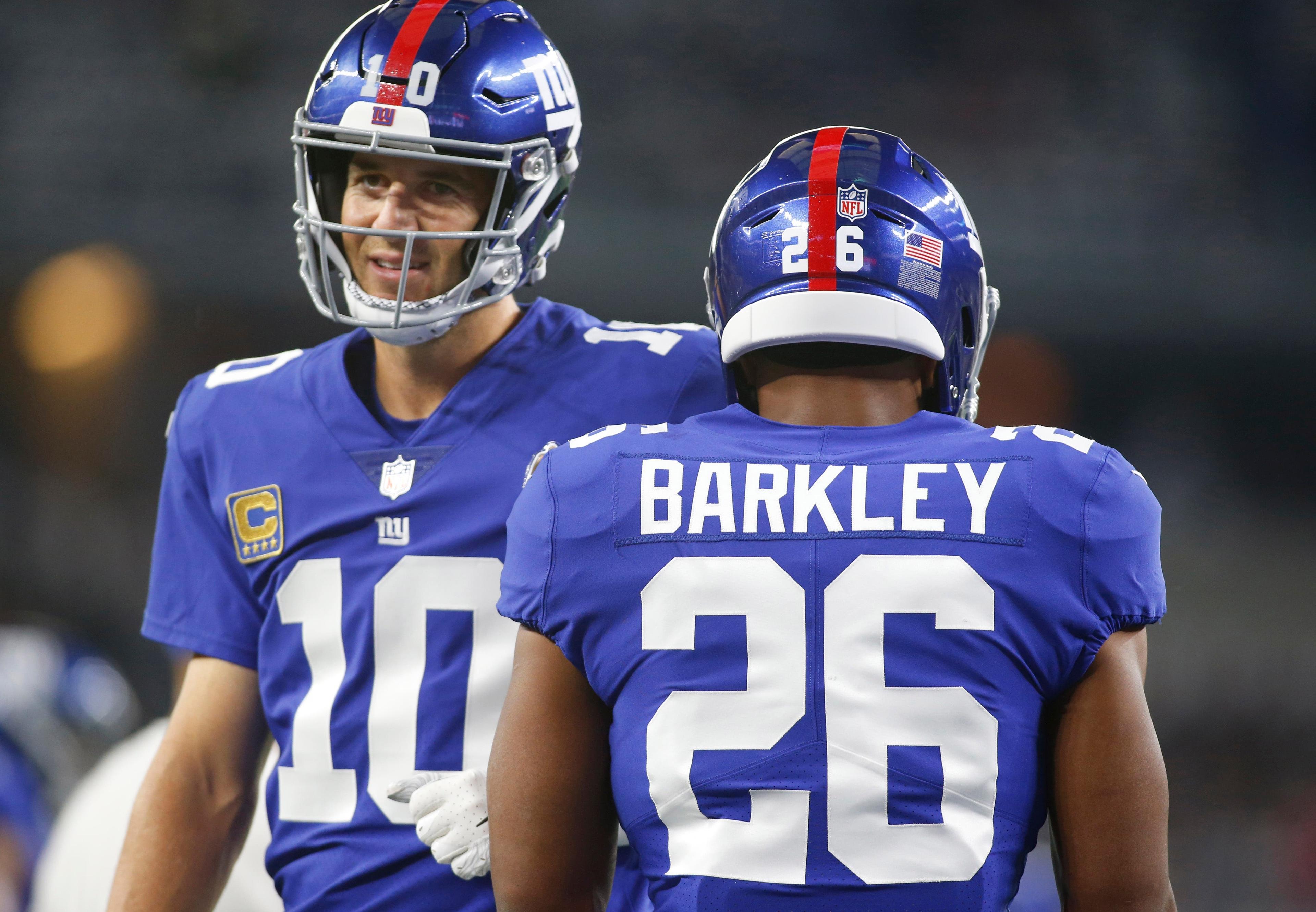 Saquon Barkley (26) and quarterback Eli Manning (10) Mandatory Credit: Tim Heitman-USA TODAY Sports / Tim Heitman