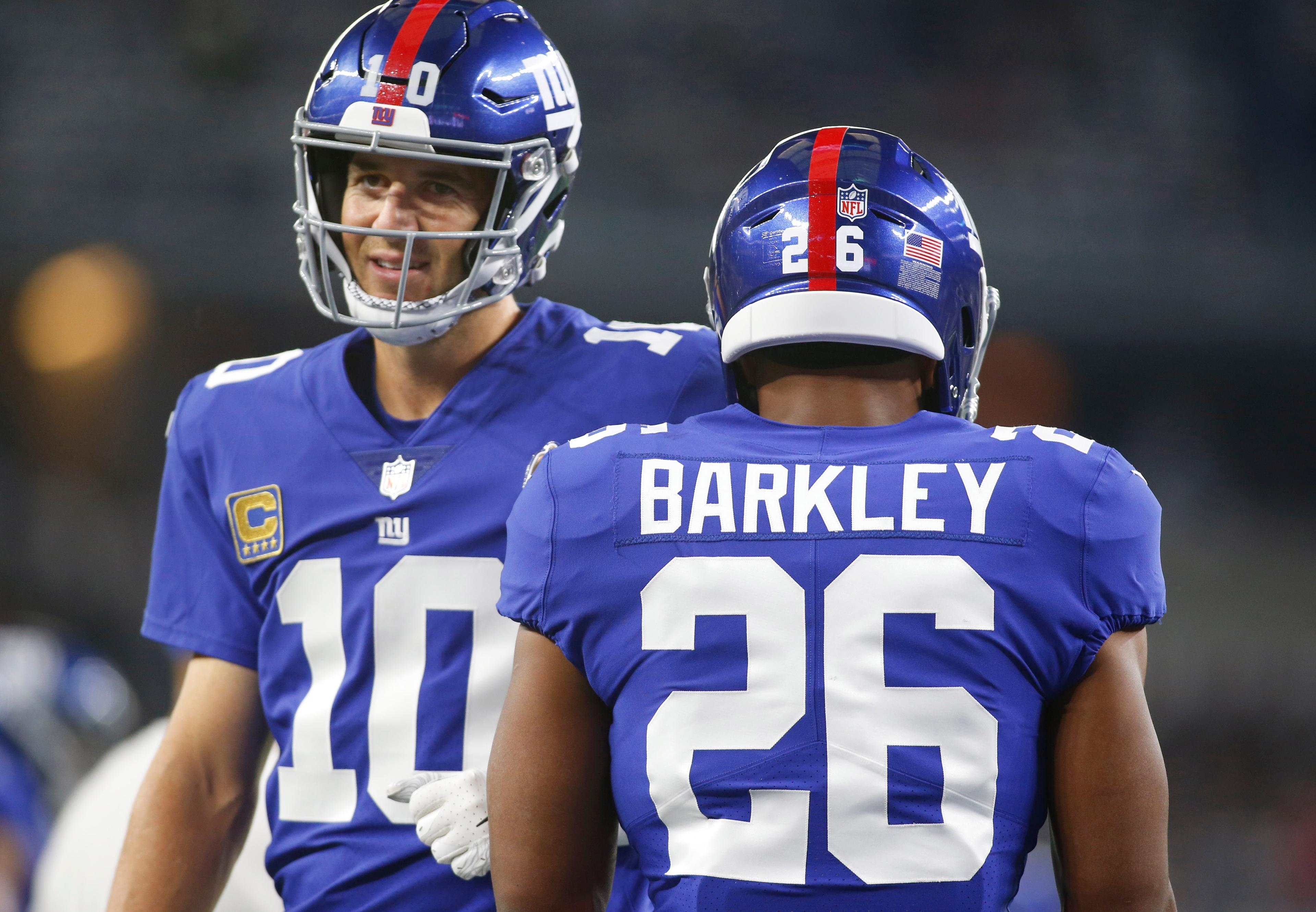 Saquon Barkley (26) and quarterback Eli Manning (10) Mandatory Credit: Tim Heitman-USA TODAY Sports