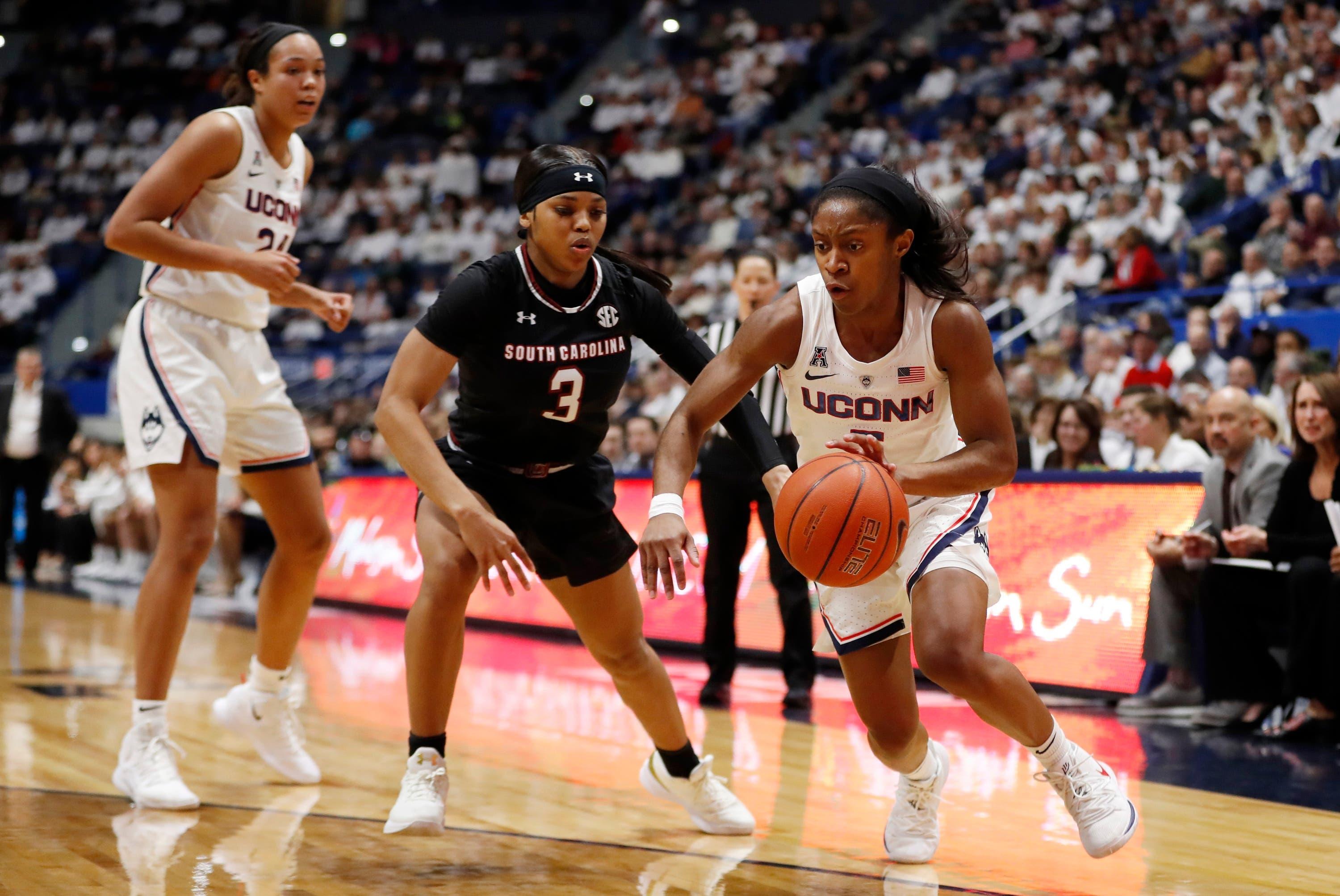 Feb 11, 2019; Hartford, CT, USA; Connecticut Huskies guard Crystal Dangerfield (5) drives the ball against South Carolina Gamecocks guard Destanni Henderson (3) in the first half at XL Center. Mandatory Credit: David Butler II-USA TODAY Sports / David Butler II