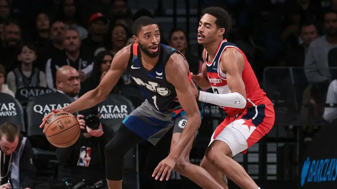 Brooklyn Nets forward Mikal Bridges (1) dribbles against Washington Wizards guard Jordan Poole (13) during the second half at Barclays Center. / Vincent Carchietta-USA TODAY Sports