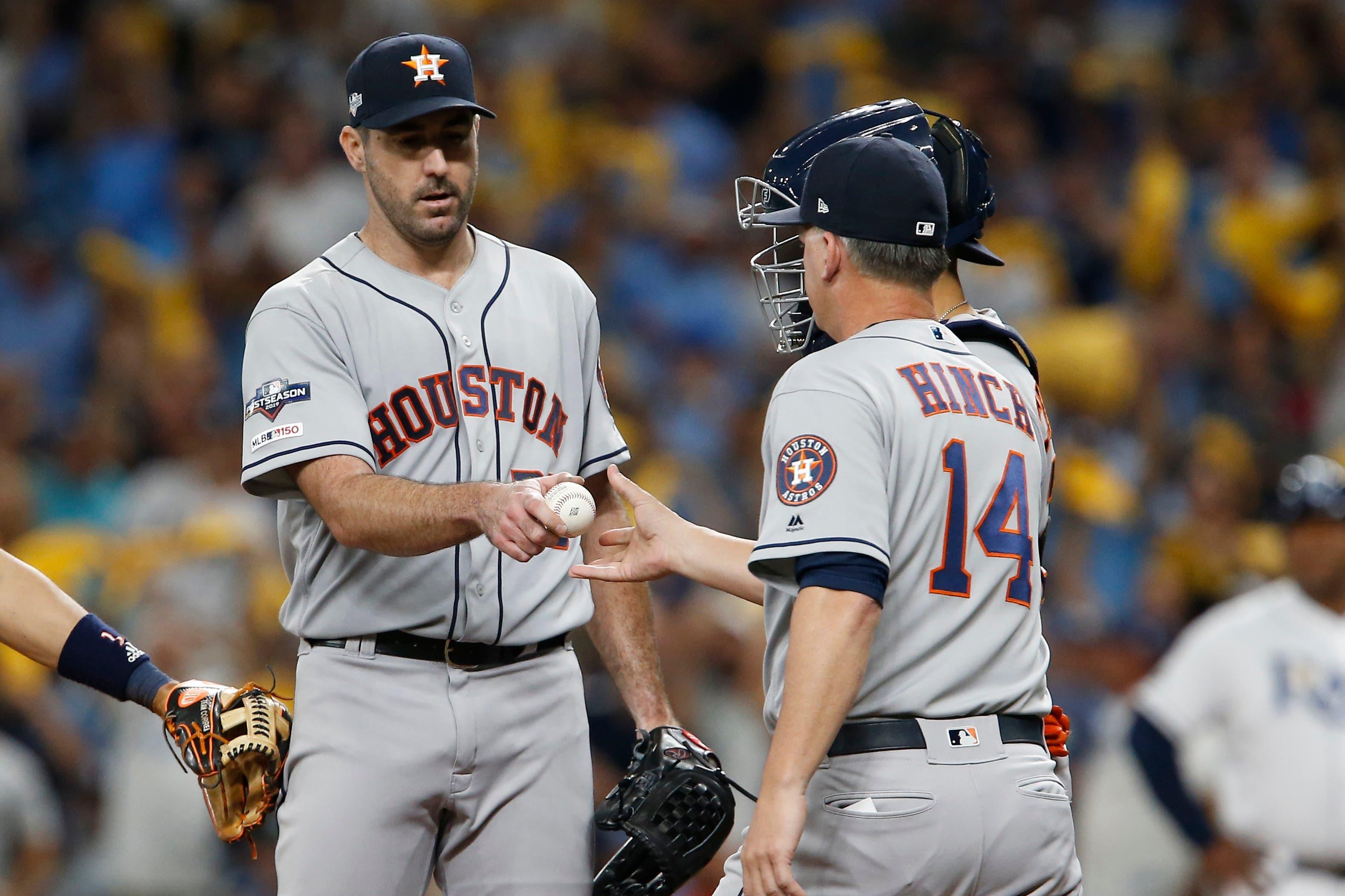 Oct 8, 2019; St. Petersburg, FL, USA; Houston Astros starting pitcher Justin Verlander (35) is taken out of the game by manager AJ Hinch (14) during the fourth inning in game four of the 2019 ALDS playoff baseball series against the Tampa Bay Rays at Tropicana Field. Mandatory Credit: Reinhold Matay-USA TODAY Sports / Reinhold Matay