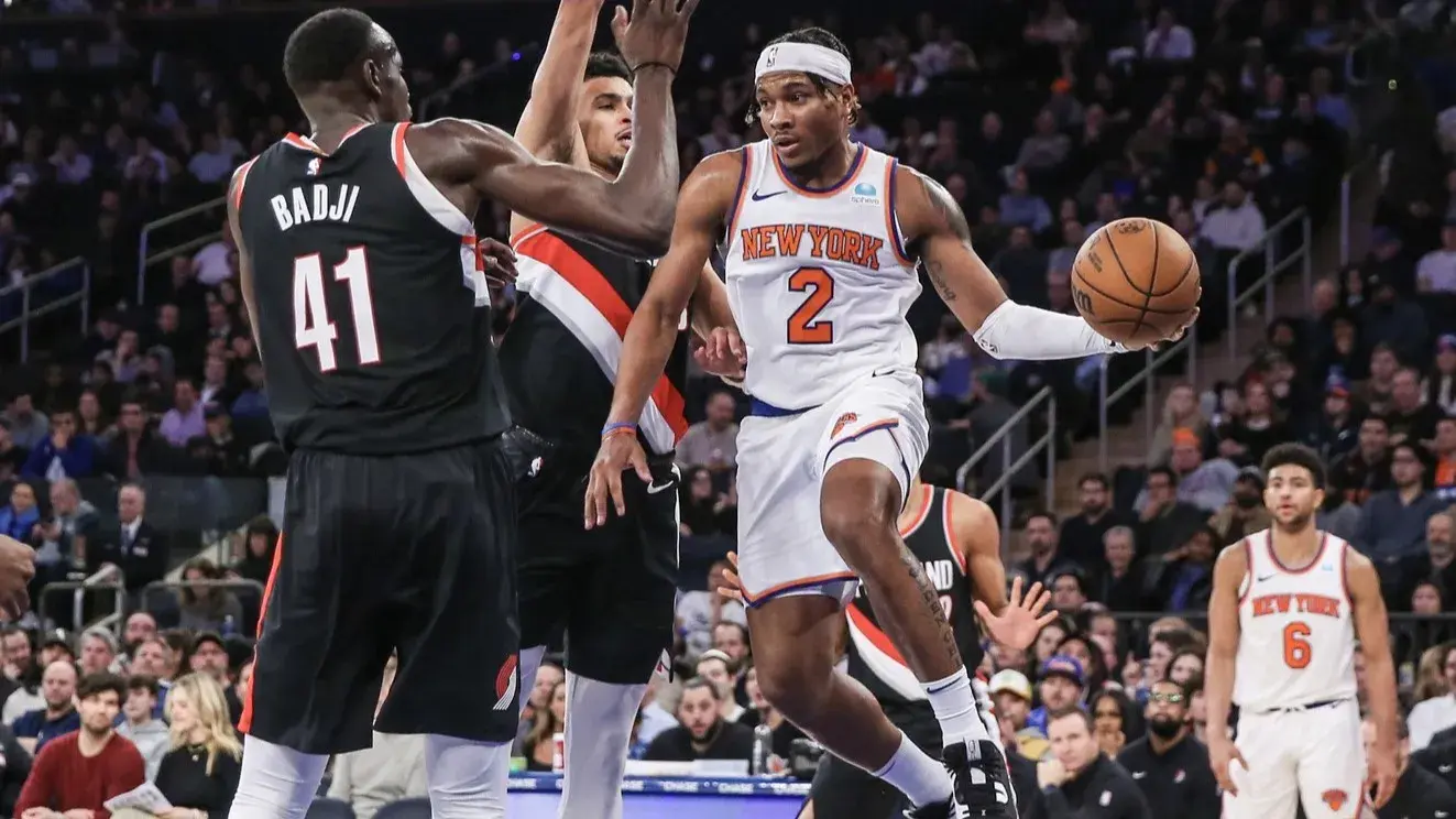 Jan 9, 2024; New York, New York, USA; New York Knicks guard Miles McBride (2) drives past Portland Trail Blazers center Ibou Badji (41) in the fourth quarter at Madison Square Garden. / Wendell Cruz-USA TODAY Sports