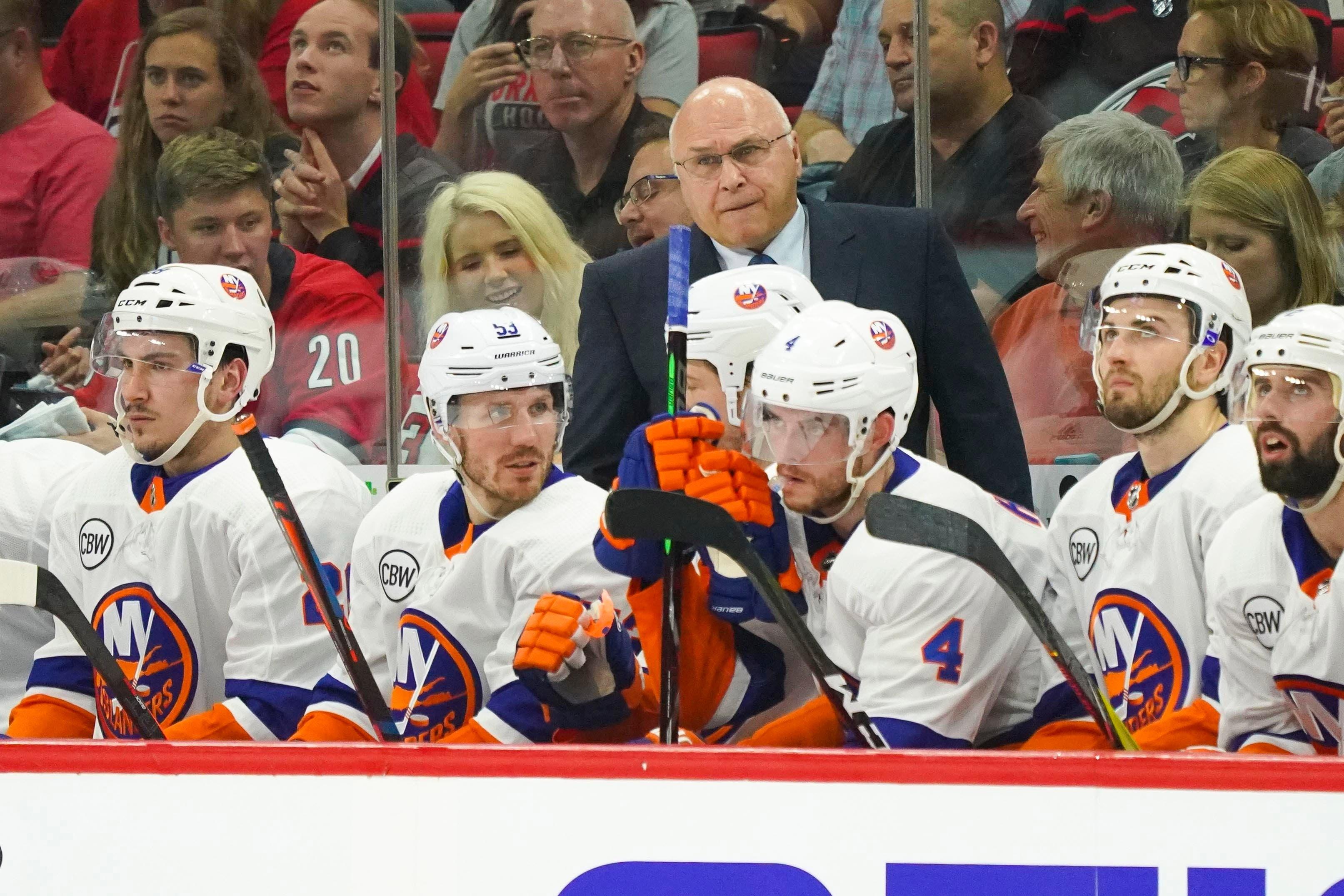 May 3, 2019; Raleigh, NC, USA; New York Islanders head coach Barry Trotz looks on from behind the players bench against the Carolina Hurricanes during the third period in game four of the second round of the 2019 Stanley Cup Playoffs at PNC Arena. The Carolina Hurricanes defeated the New York Islanders 5-2. Mandatory Credit: James Guillory-USA TODAY Sports / James Guillory