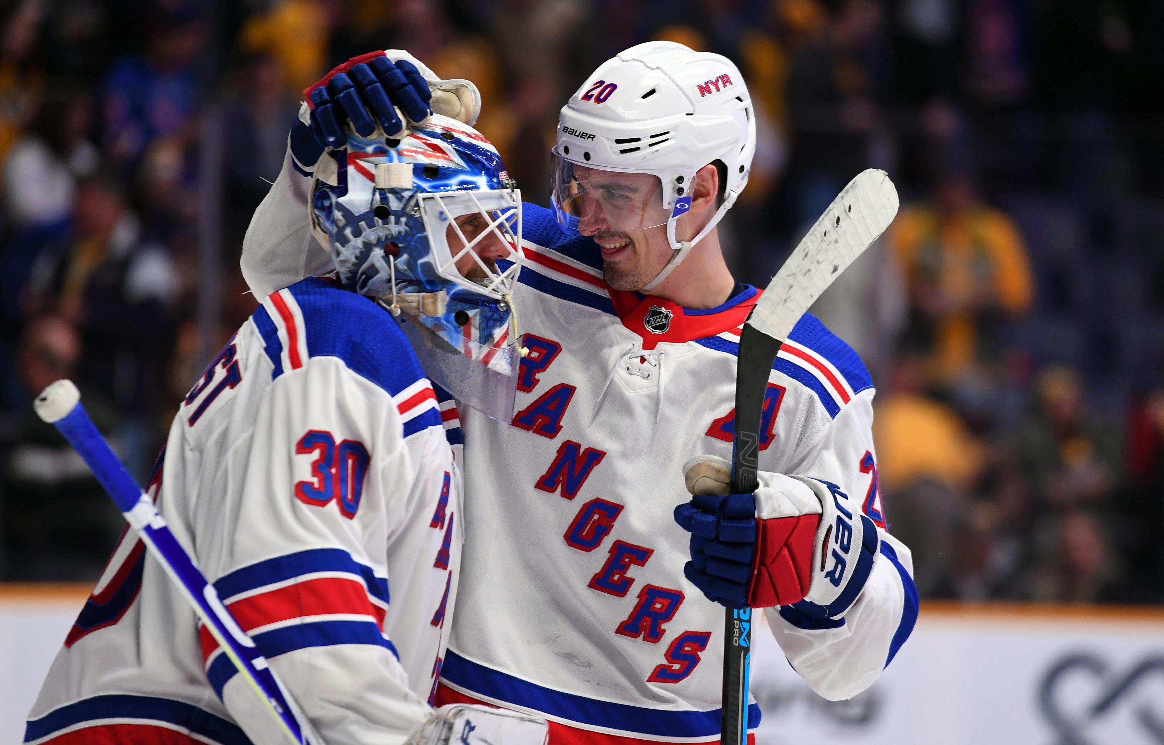 Dec 29, 2018; Nashville, TN, USA; New York Rangers goaltender Henrik Lundqvist (30) celebrates with New York Rangers left wing Chris Kreider (20) after a win against the Nashville Predators at Bridgestone Arena. Mandatory Credit: Christopher Hanewinckel-USA TODAY Sports