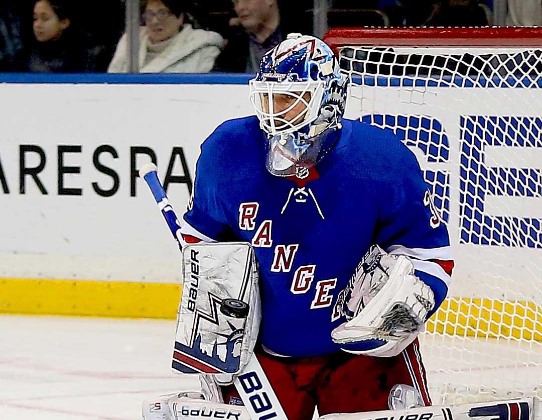 New York Rangers goaltender Henrik Lundqvist makes a save against the Tampa Bay Lightning during the first period at Madison Square Garden.