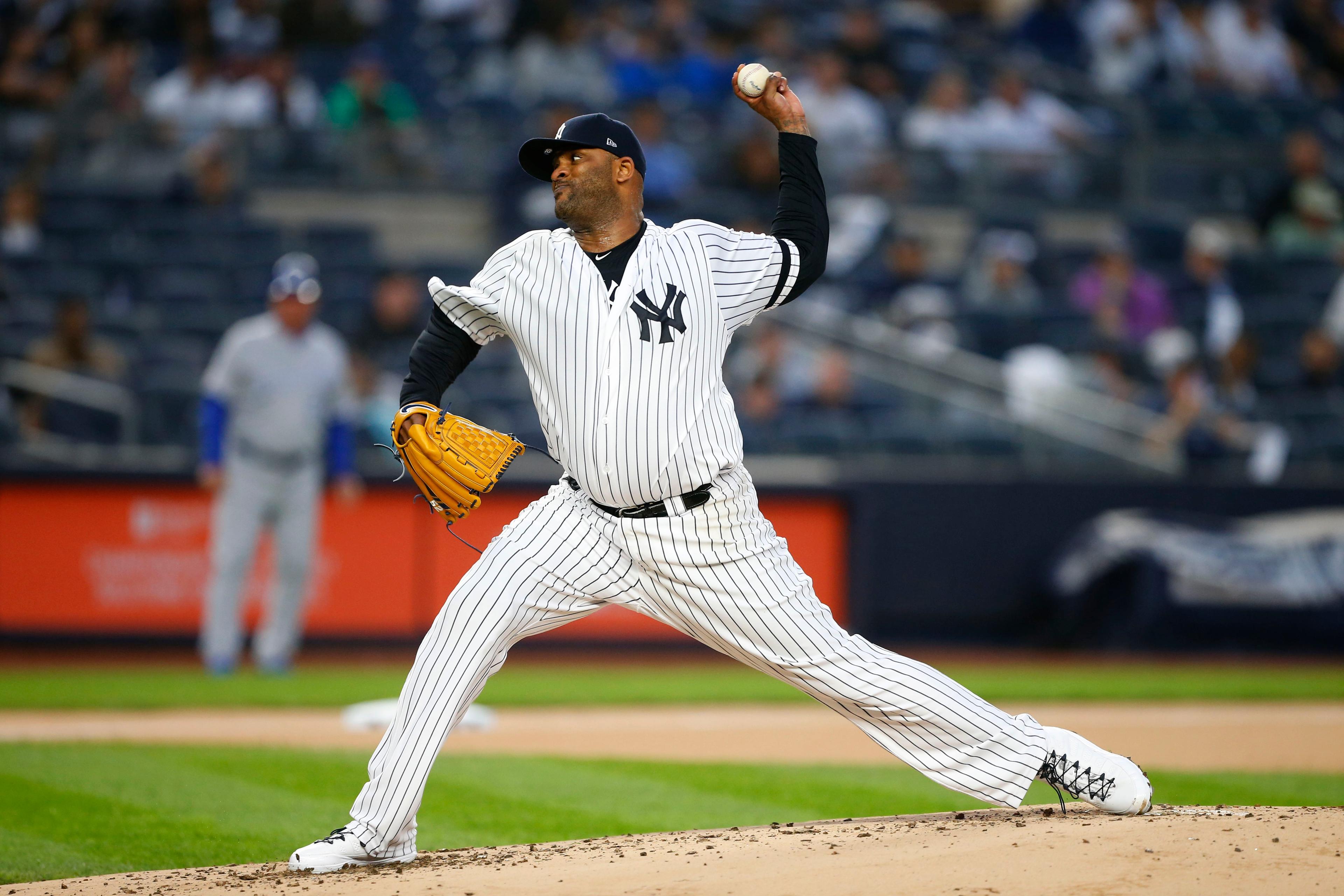 Apr 19, 2019; Bronx, NY, USA; New York Yankees starting pitcher CC Sabathia (52) delivers a pitch in the first inning against the Kansas City Royals at Yankee Stadium. Mandatory Credit: Noah K. Murray-USA TODAY Sports