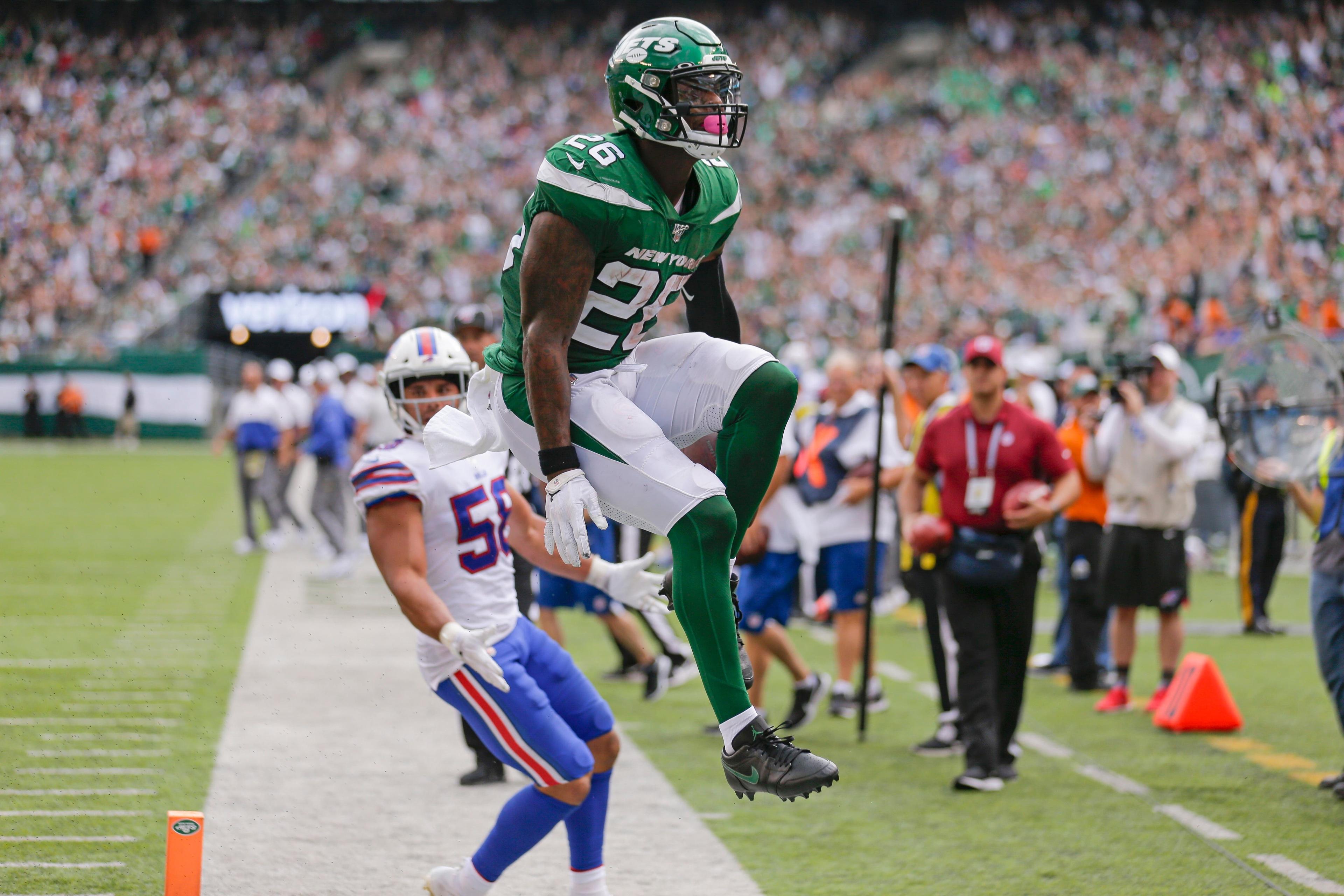 New York Jets running back Le'Veon Bell (26) celebrates after running past Buffalo Bills' Matt Milano (58) for a touchdown during the second half of an NFL football game Sunday, Sept. 8, 2019, in East Rutherford, N.J. (AP Photo/Seth Wenig) / Seth Wenig/AP