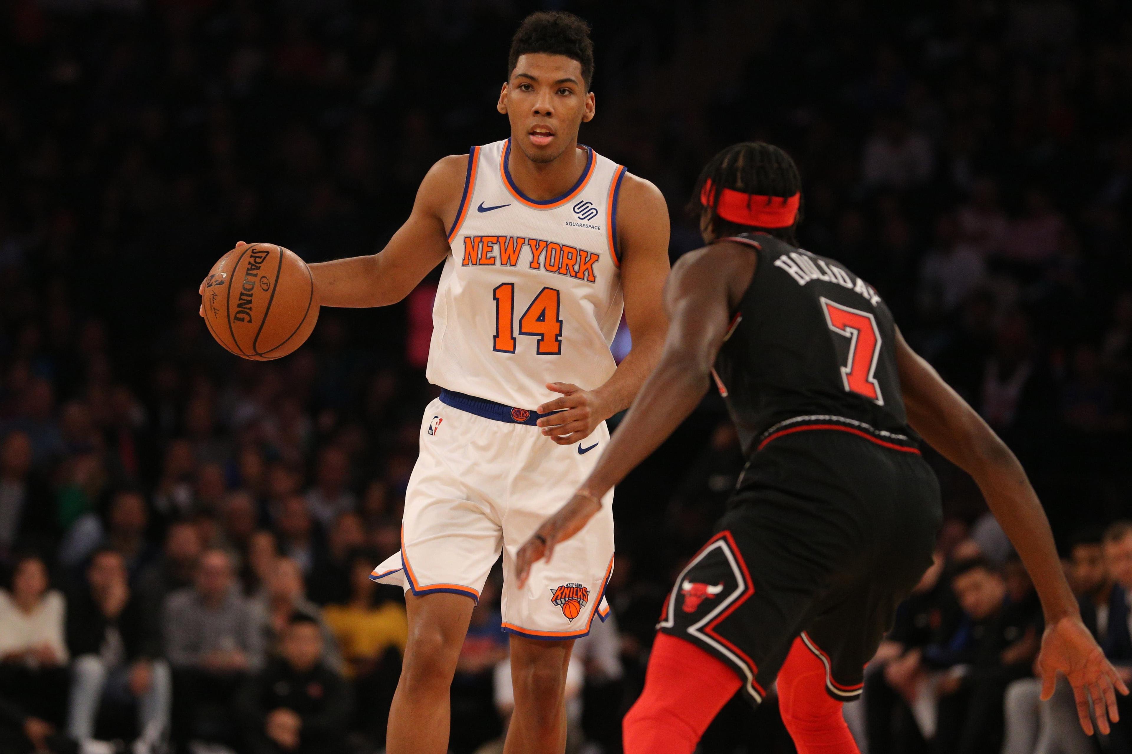 New York Knicks shooting guard Allonzo Trier controls the ball against Chicago Bulls small forward Justin Holiday during the first quarter at Madison Square Garden. / Brad Penner/USA TODAY Sports