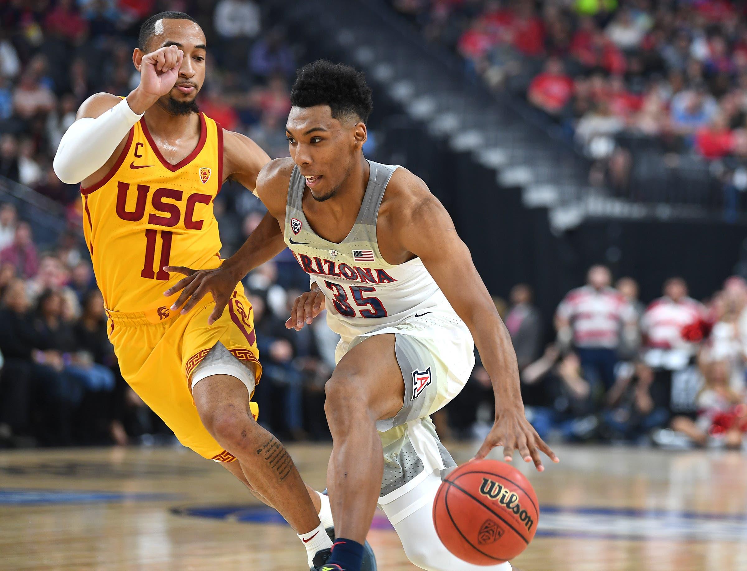 Mar 10, 2018; Las Vegas, NV, USA; Arizona Wildcats guard Allonzo Trier (35) dribbles against USC Trojans guard Jordan McLaughlin (11) during the Pac-12 Tournament championship at T-Mobile Arena. Mandatory Credit: Stephen R. Sylvanie-USA TODAY Sports / Stephen R. Sylvanie