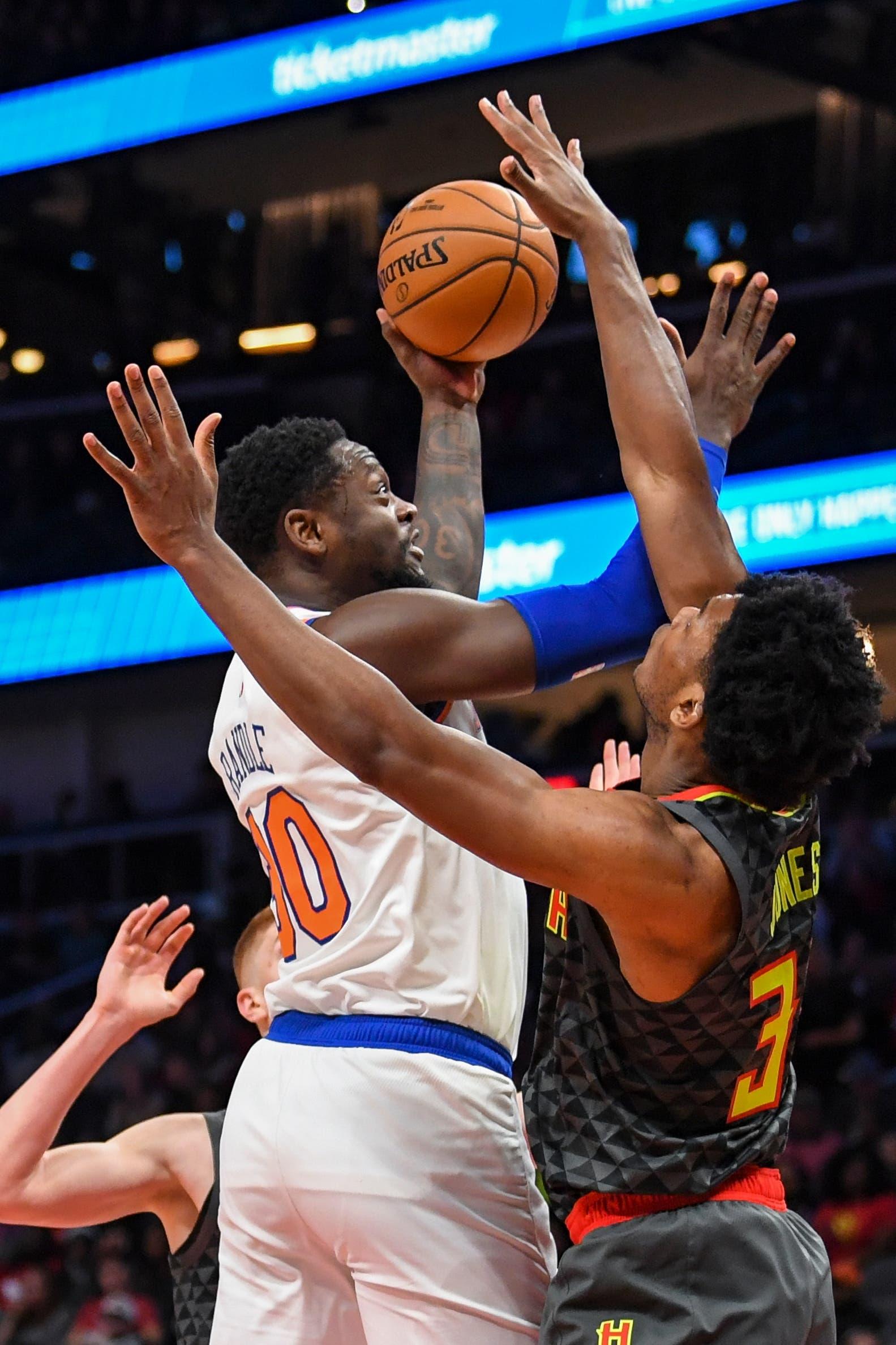 Feb 9, 2020; Atlanta, Georgia, USA; New York Knicks forward Julius Randle (30) shoots against Atlanta Hawks center Damian Jones (30) during the first quarter at State Farm Arena. Mandatory Credit: Dale Zanine-USA TODAY Sports / DALE ZANINE