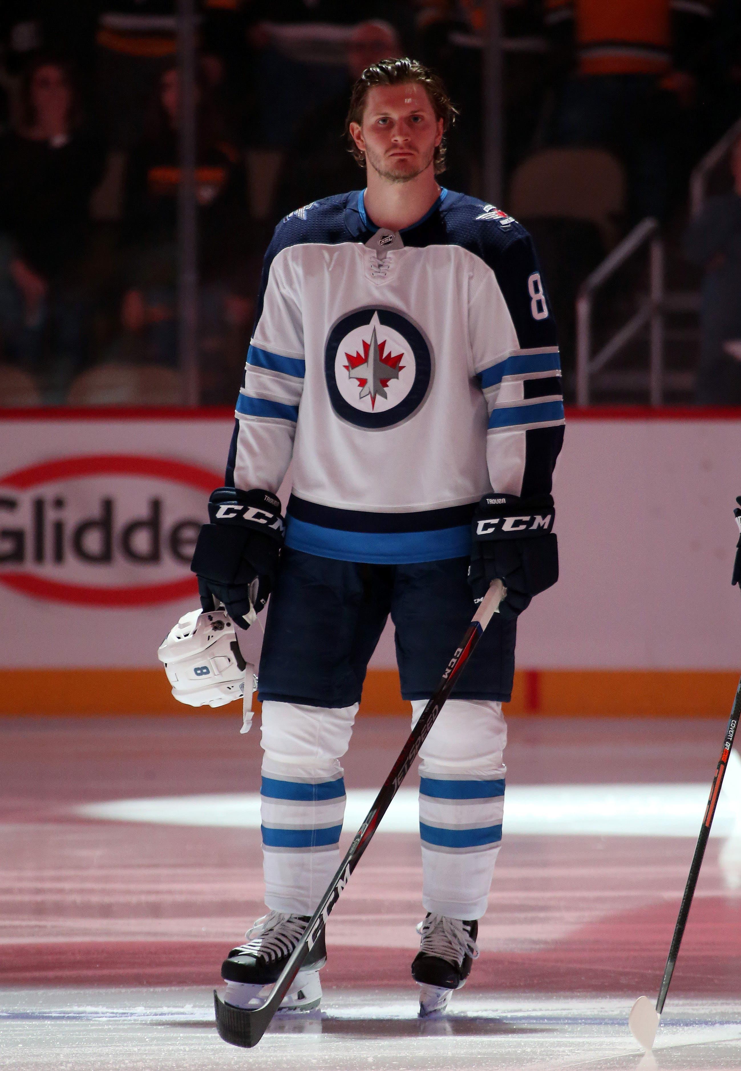 Jan 4, 2019; Pittsburgh, PA, USA; Winnipeg Jets defenseman Jacob Trouba (8) stands for the national anthem against the Pittsburgh Penguins at PPG PAINTS Arena. The Pens won 4-0. Mandatory Credit: Charles LeClaire-USA TODAY Sports / Charles LeClaire