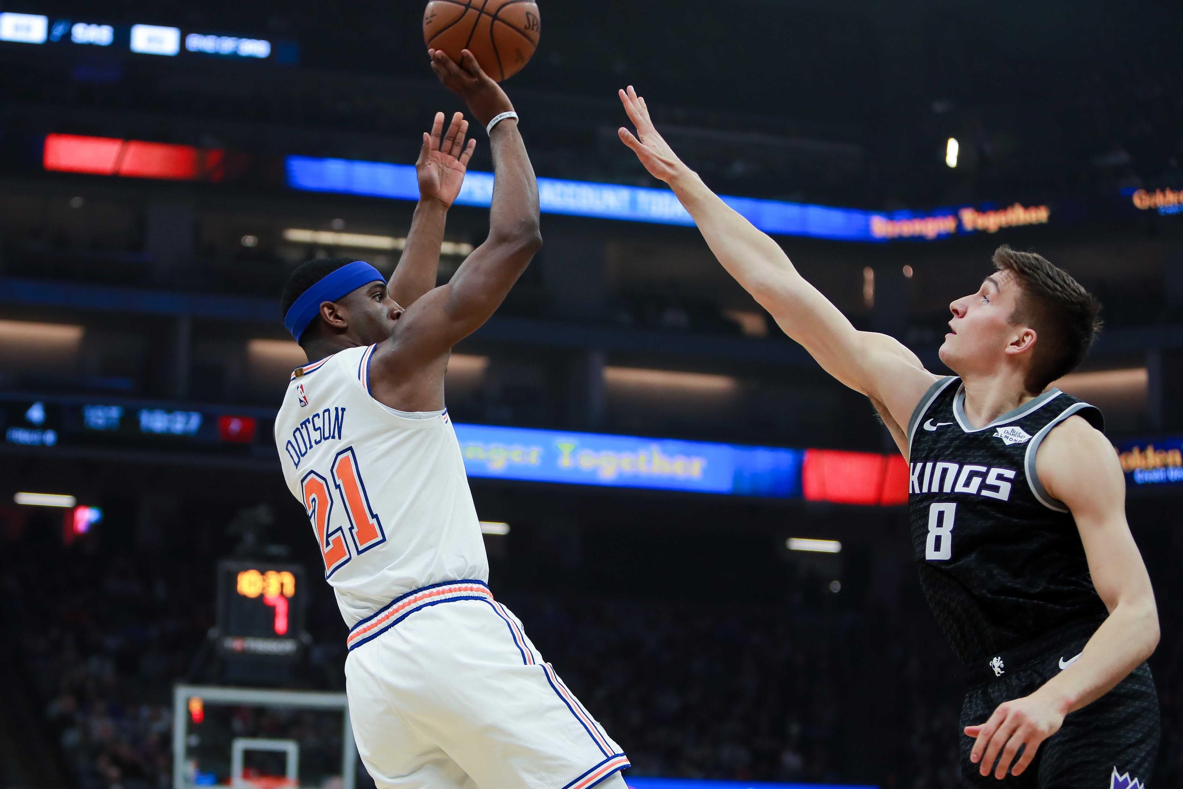 New York Knicks guard Damyean Dotson shoots the ball over Sacramento Kings guard Bogdan Bogdanovic during the first quarter at Golden 1 Center. / Sergio Estrada/USA TODAY Sports