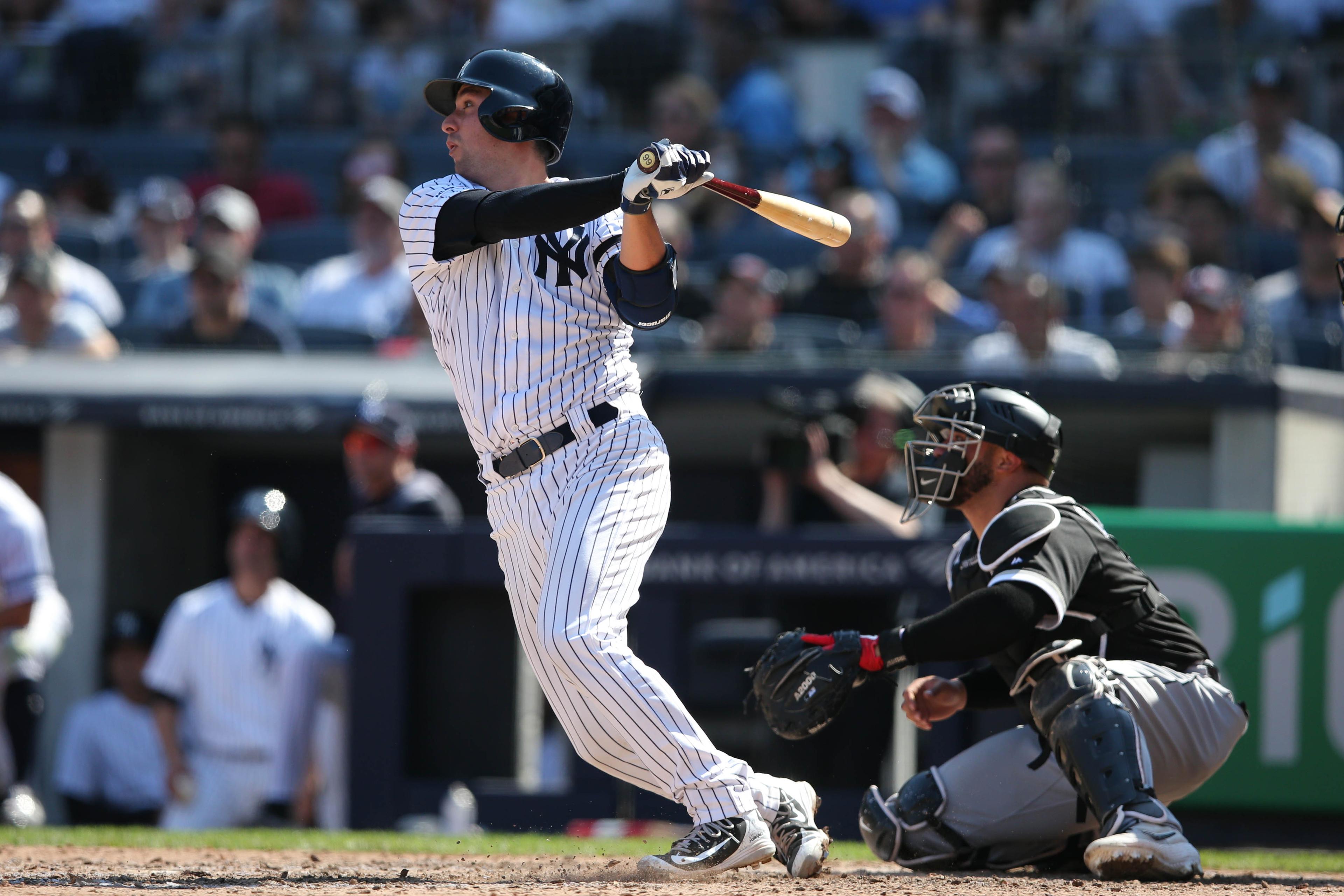 Apr 13, 2019; Bronx, NY, USA; New York Yankees catcher Kyle Higashioka (66) hits an RBI sacrifice fly against the Chicago White Sox during the seventh inning at Yankee Stadium. Mandatory Credit: Brad Penner-USA TODAY Sports