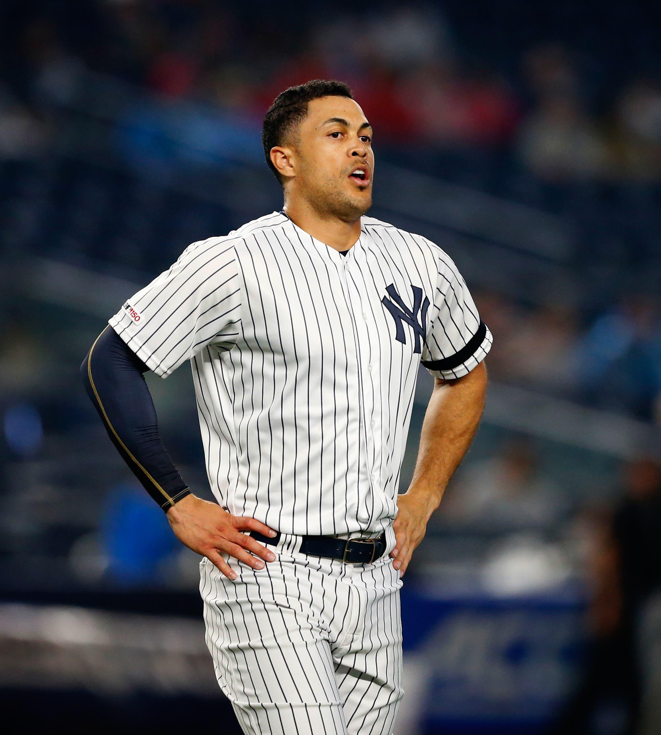 Jun 20, 2019; Bronx, NY, USA; New York Yankees right fielder Giancarlo Stanton (27) between innings against the Houston Astros at Yankee Stadium. Mandatory Credit: Noah K. Murray-USA TODAY Sports / Noah K. Murray