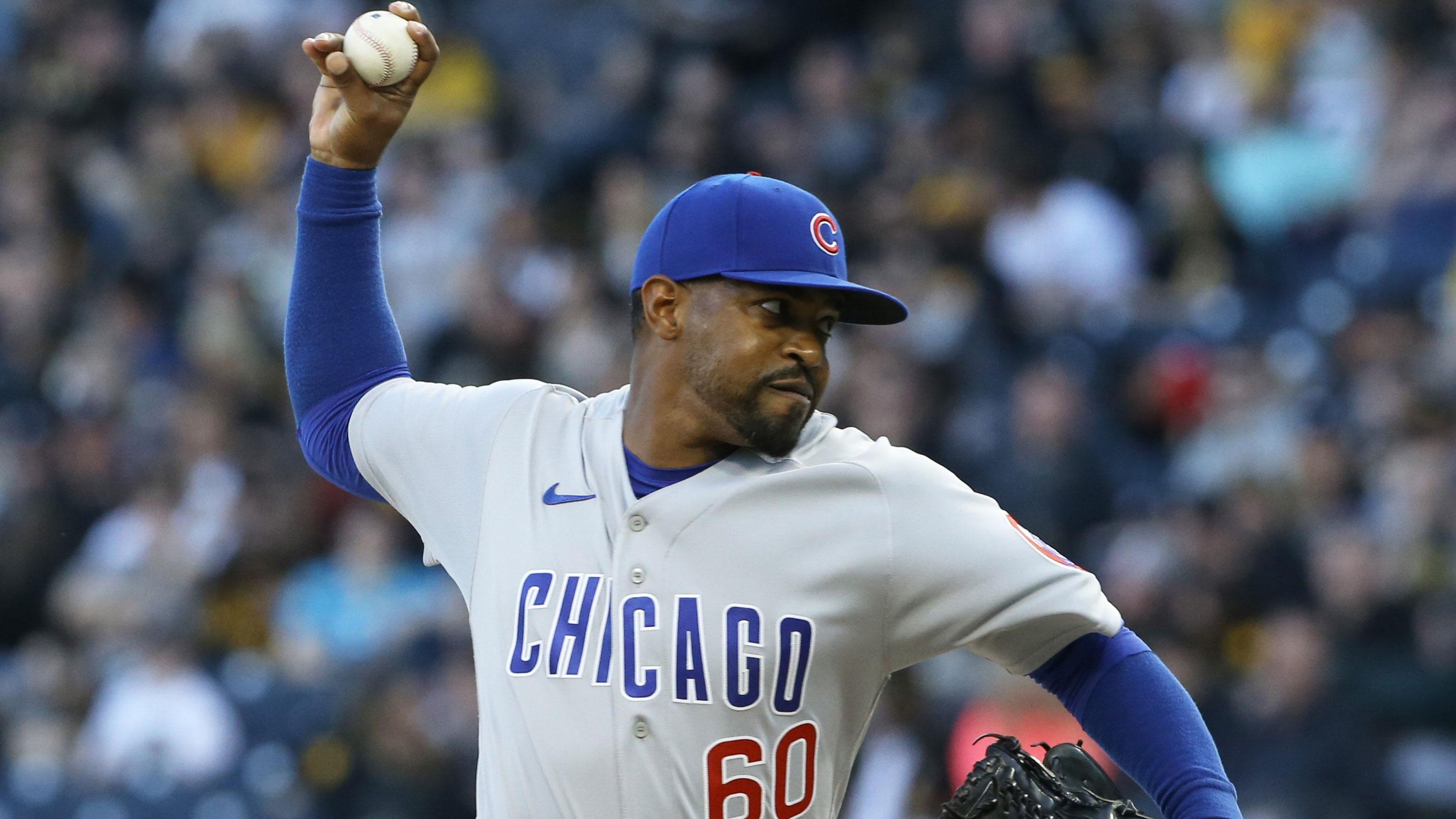 Apr 12, 2022; Pittsburgh, Pennsylvania, USA; Chicago Cubs relief pitcher Mychal Givens (60) pitches against the Pittsburgh Pirates during the eighth inning at PNC Park.