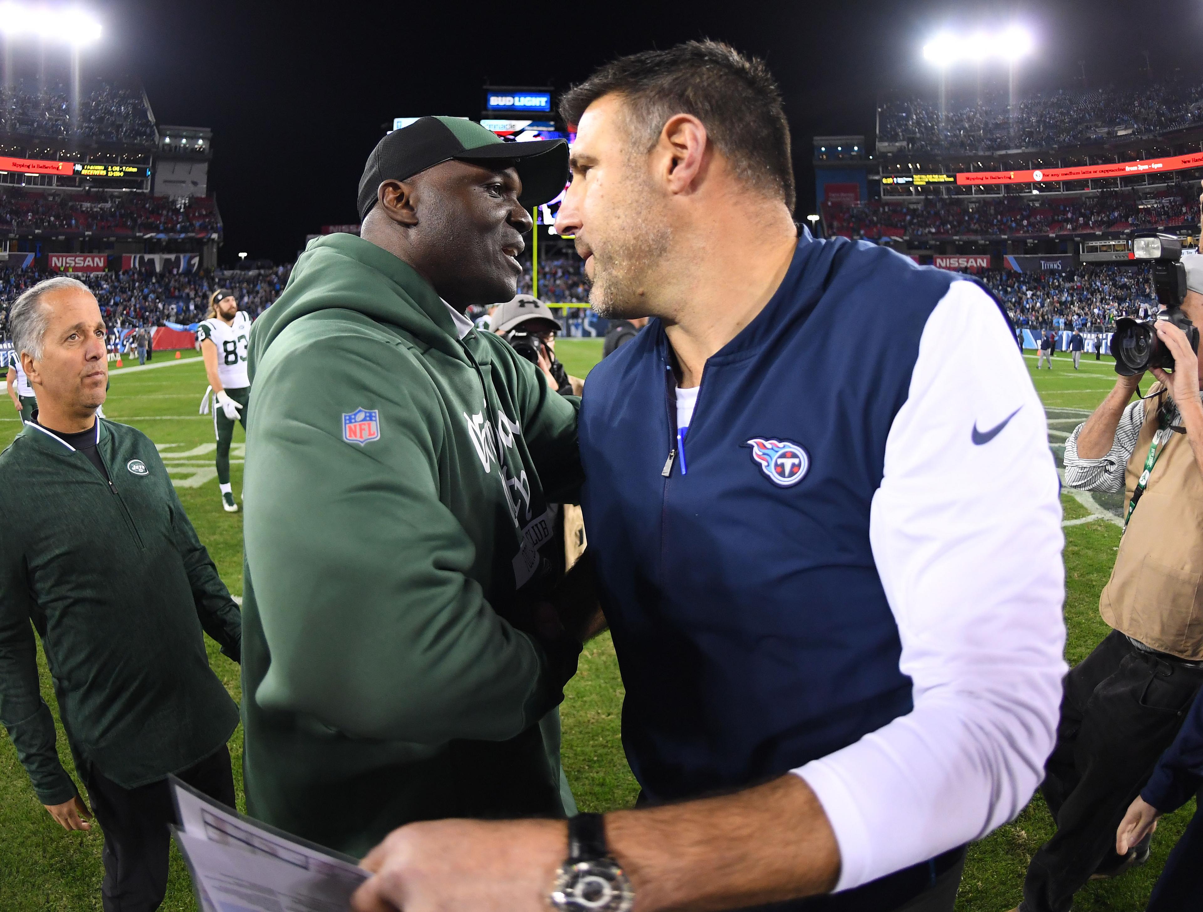 New York Jets head coach Todd Bowles and Tennessee Titans head coach Mike Vrabel after a Titans win at Nissan Stadium.