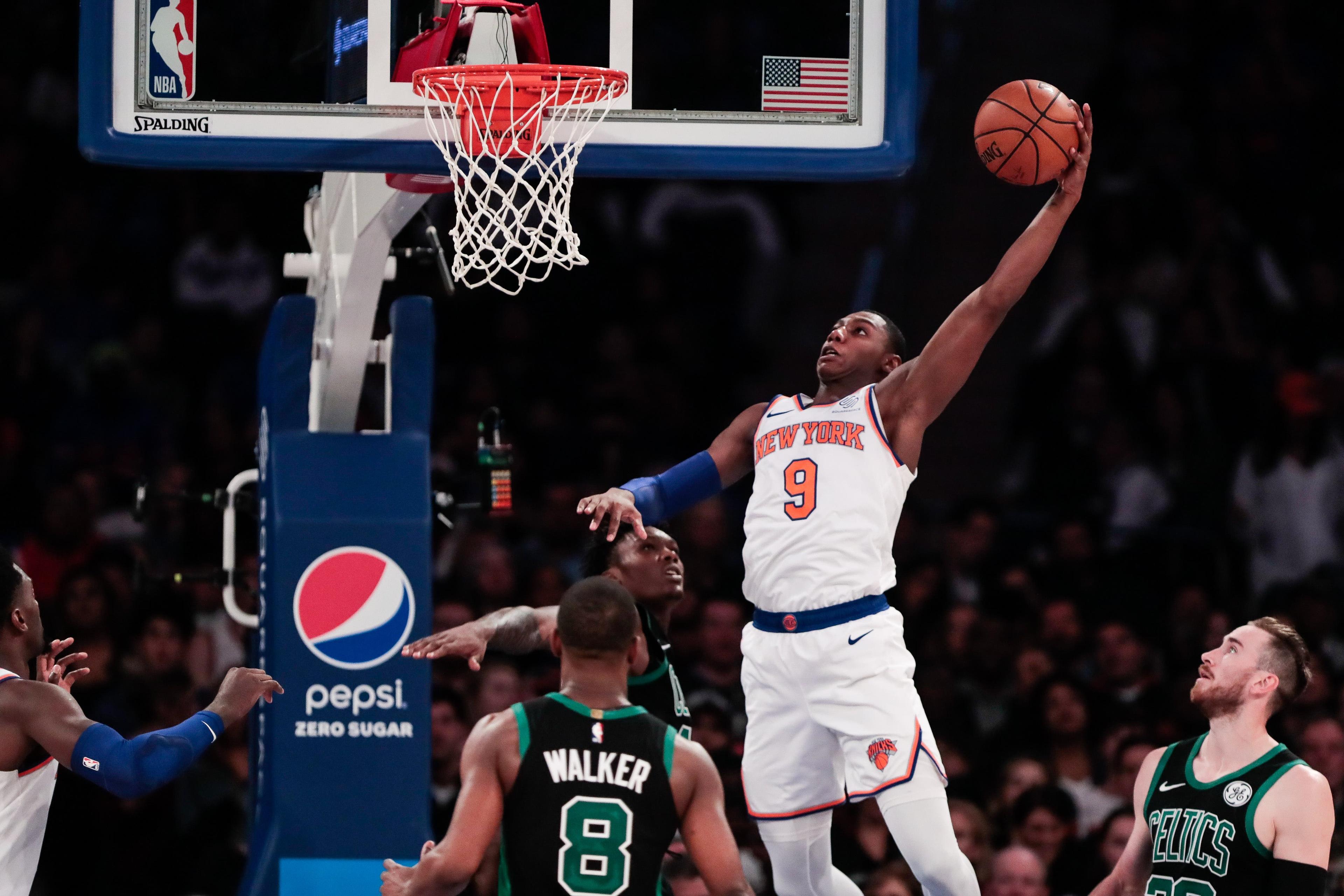 Oct 26, 2019; New York, NY, USA; New York Knicks forward RJ Barrett (9) dunks the ball in front of Boston Celtics guard Kemba Walker (8) during the second half at Madison Square Garden. Mandatory Credit: Vincent Carchietta-USA TODAY Sportsundefined