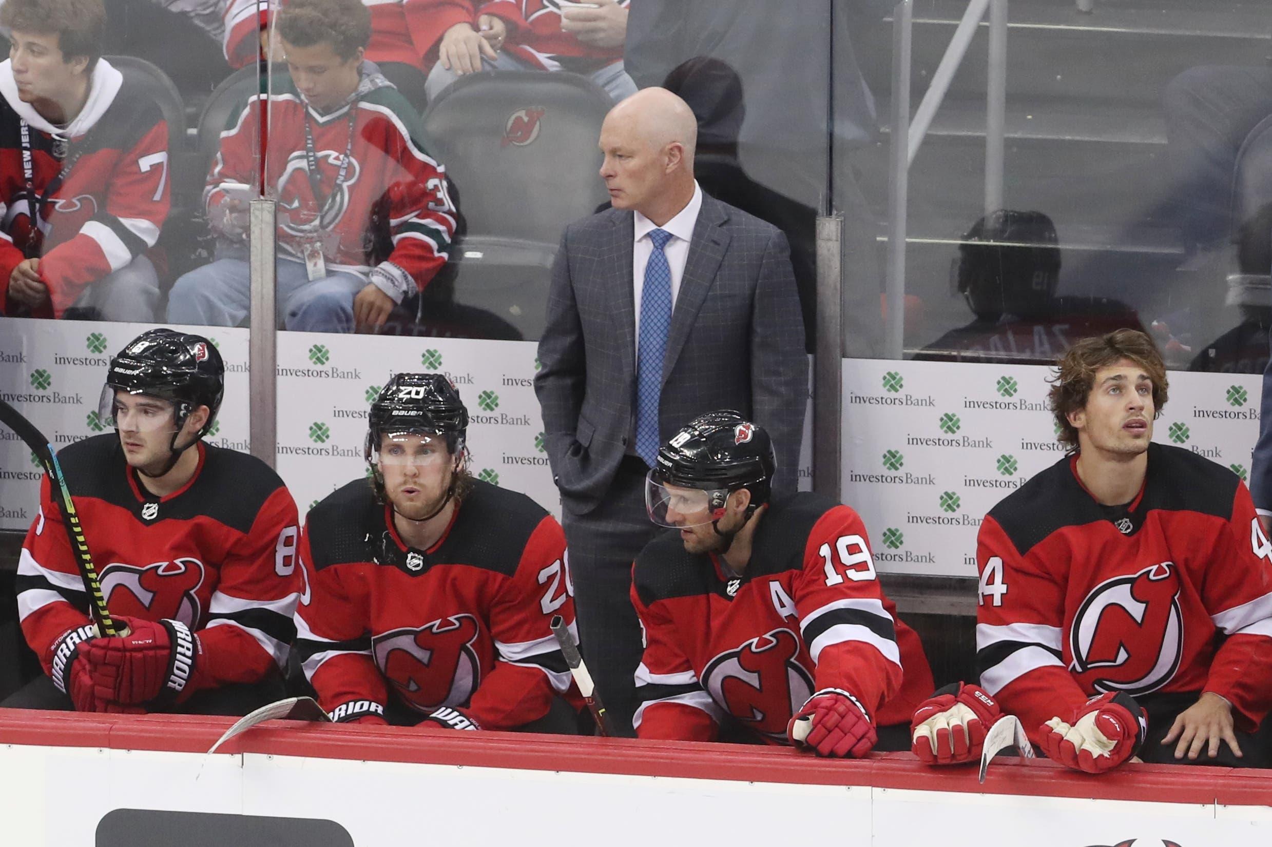 Oct 14, 2019; Newark, NJ, USA; New Jersey Devils head coach John Hynes on the bench during the third period of their game against the Florida Panthers at Prudential Center. Mandatory Credit: Ed Mulholland-USA TODAY Sports / Ed Mulholland