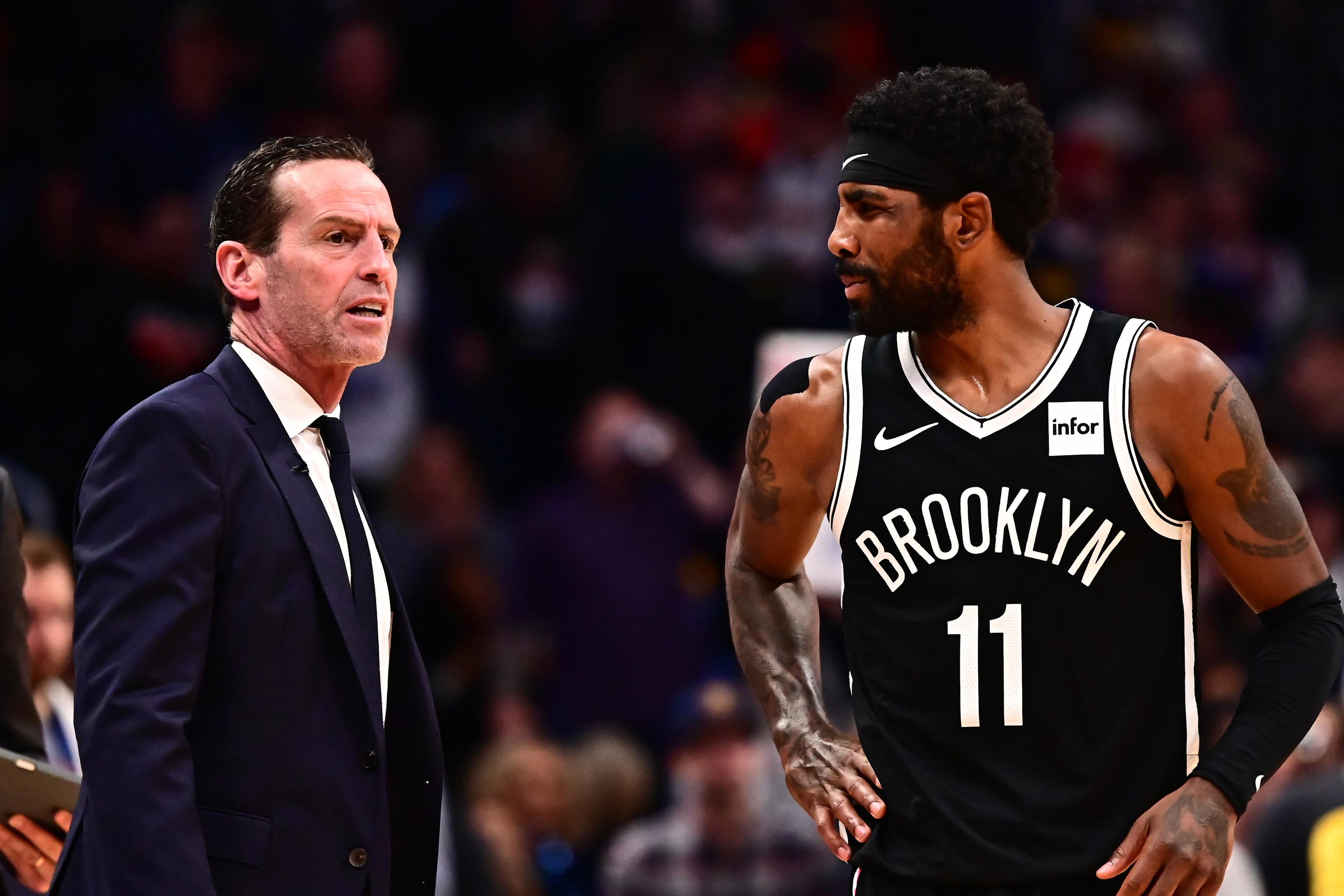 Nov 14, 2019; Denver, CO, USA; Brooklyn Net head coach Kenny Atkinson and guard Kyrie Irving (11) talk in the fourth quarter against the Denver Nuggets at the Pepsi Center. Mandatory Credit: Ron Chenoy-USA TODAY Sports / Ron Chenoy