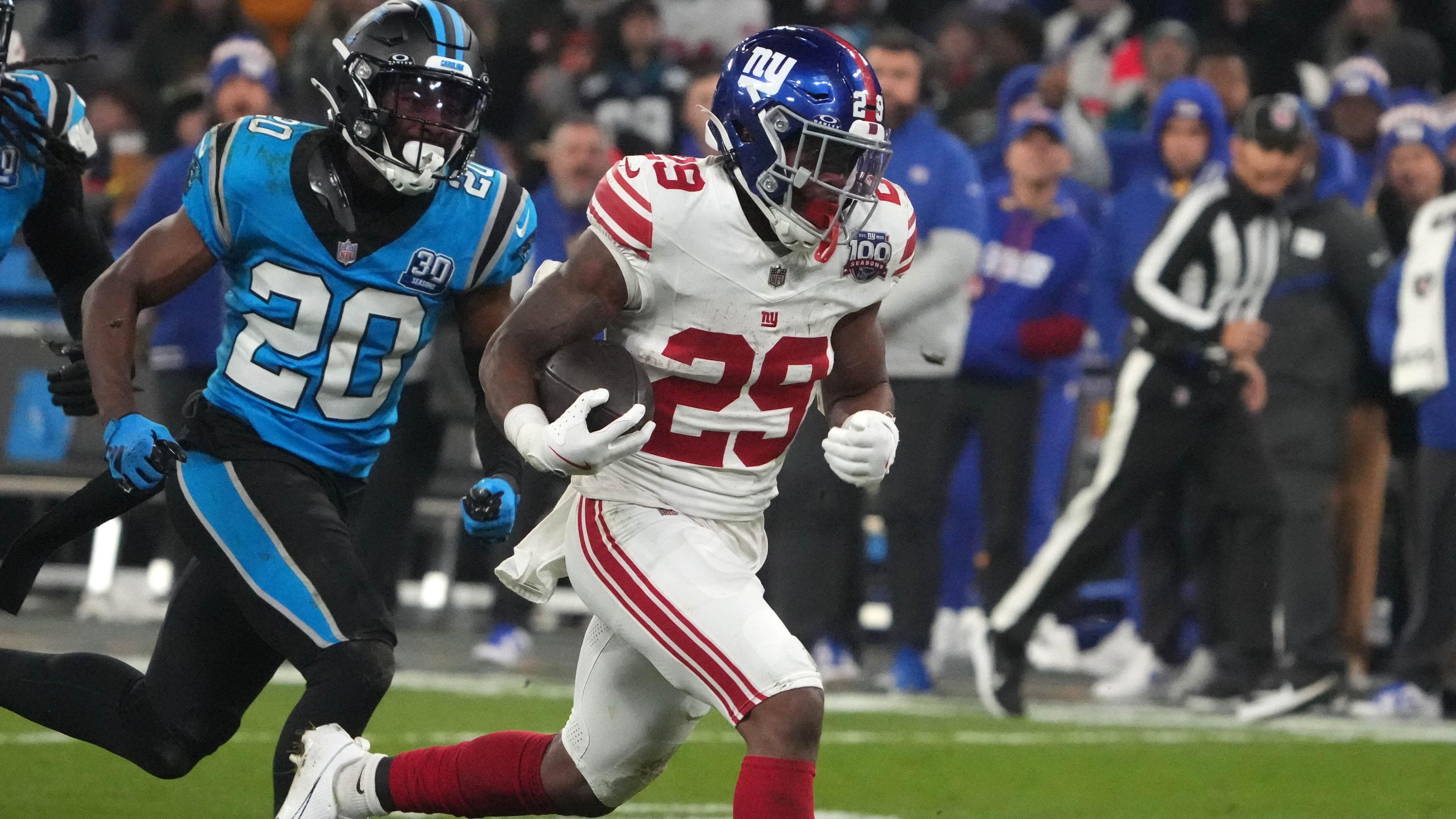 New York Giants running back Tyrone Tracy Jr. (29) carries the ball on a 32-yard touchdown run against the New York Giants in the second half during the 2024 NFL Munich Game at Allianz Arena