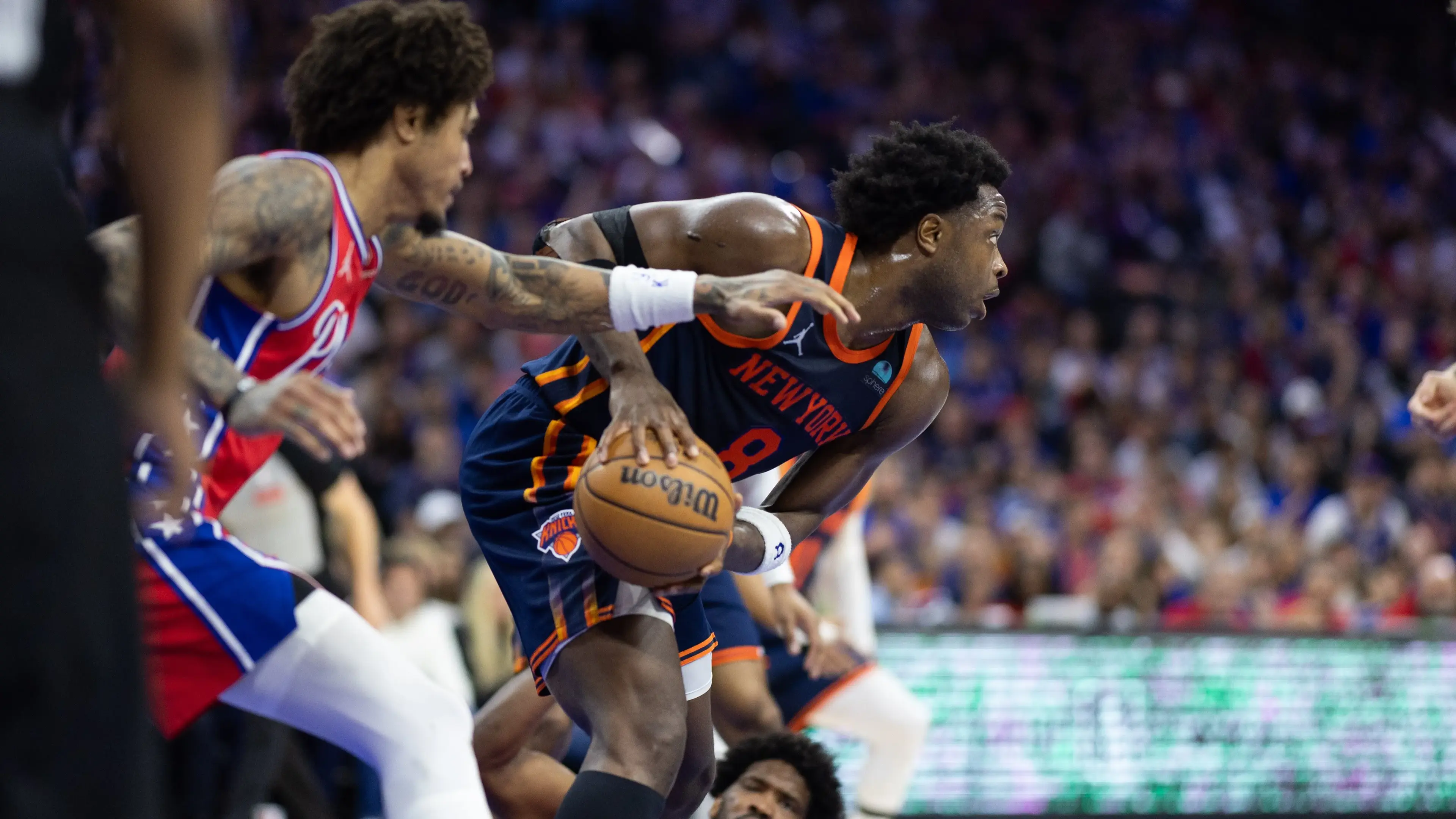 Apr 28, 2024; Philadelphia, Pennsylvania, USA; New York Knicks guard OG Anunoby (8) picks up a loose ball in front of Philadelphia 76ers center Joel Embiid (21) during the first half of game four of the first round in the 2024 NBA playoffs at Wells Fargo Center. Mandatory Credit: Bill Streicher-USA TODAY Sports / © Bill Streicher-USA TODAY Sports