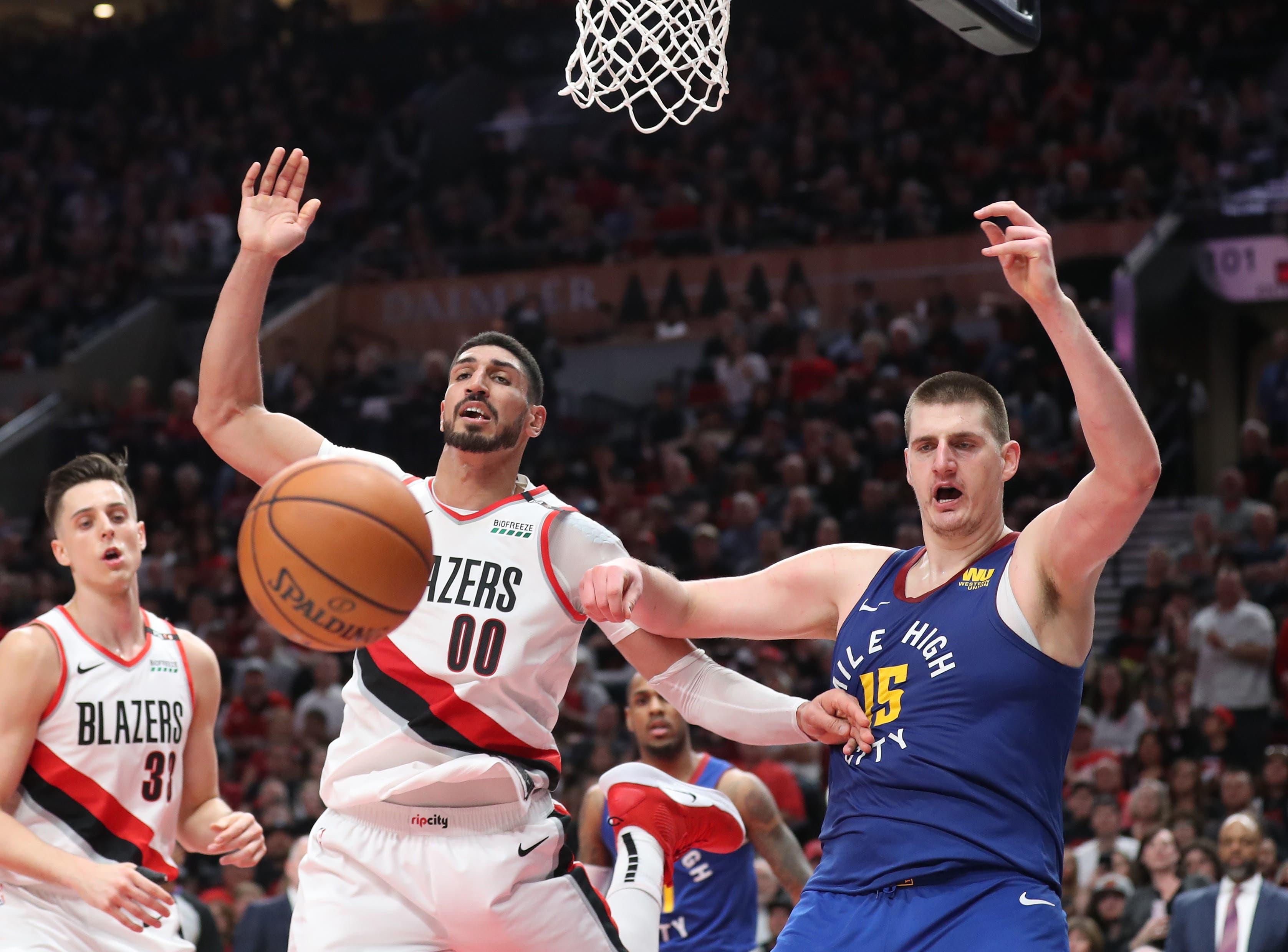 May 3, 2019; Portland, OR, USA; Portland Trail Blazers center Enes Kanter (00) and Denver Nuggets center Nikola Jokic (15) watch the ball go out of bounds in the second half of game three of the second round of the 2019 NBA Playoffs at Moda Center. Mandatory Credit: Jaime Valdez-USA TODAY Sports / Jaime Valdez