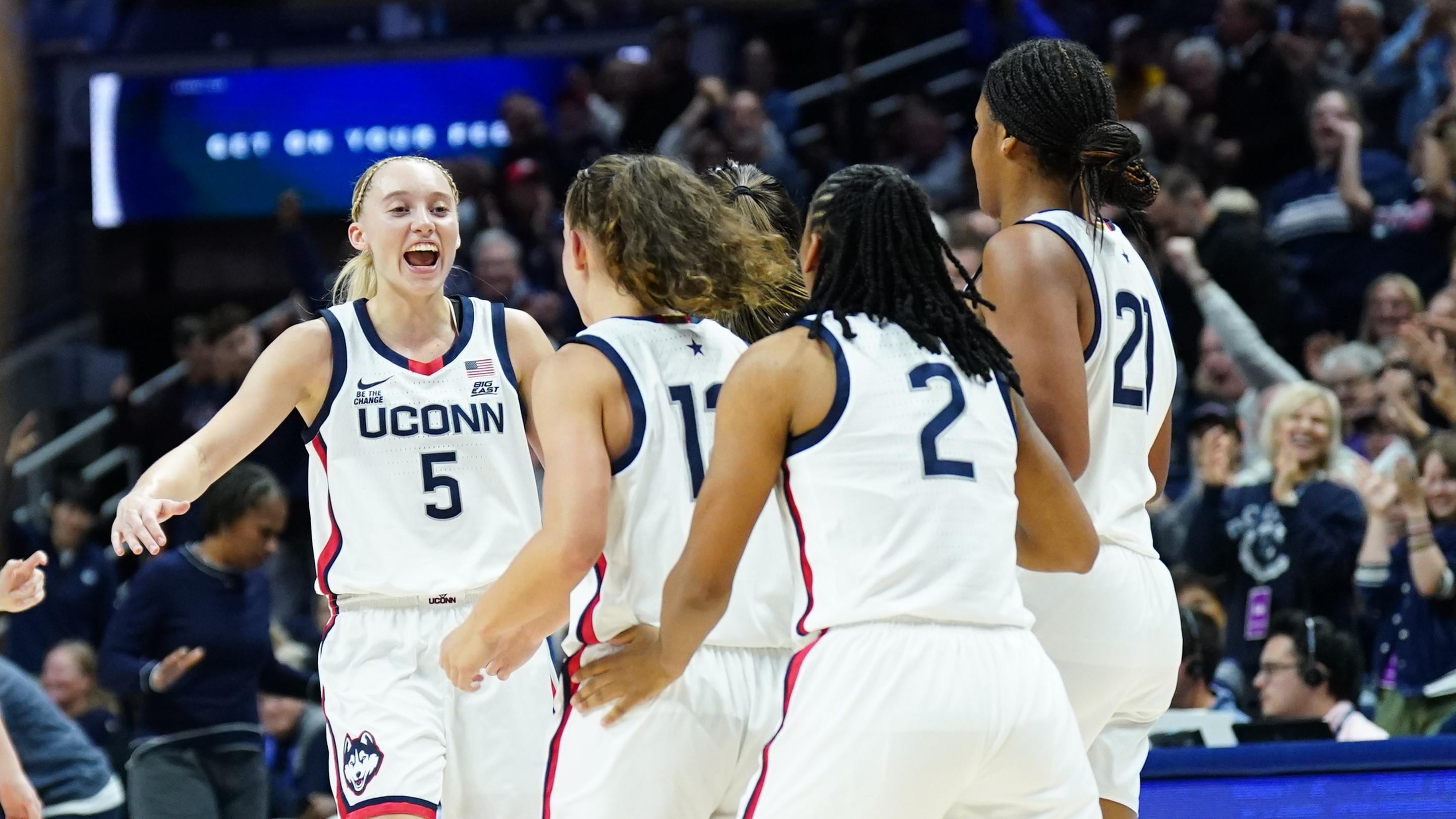 Nov 10, 2024; Storrs, Connecticut, USA; UConn Huskies guard Paige Bueckers (5) reacts after guard Ashlynn Shade (12) makes the buzzer beater three point basket against the South Florida Bulls in the first half at Harry A. Gampel Pavilion. Mandatory Credit: David Butler II-Imagn Images