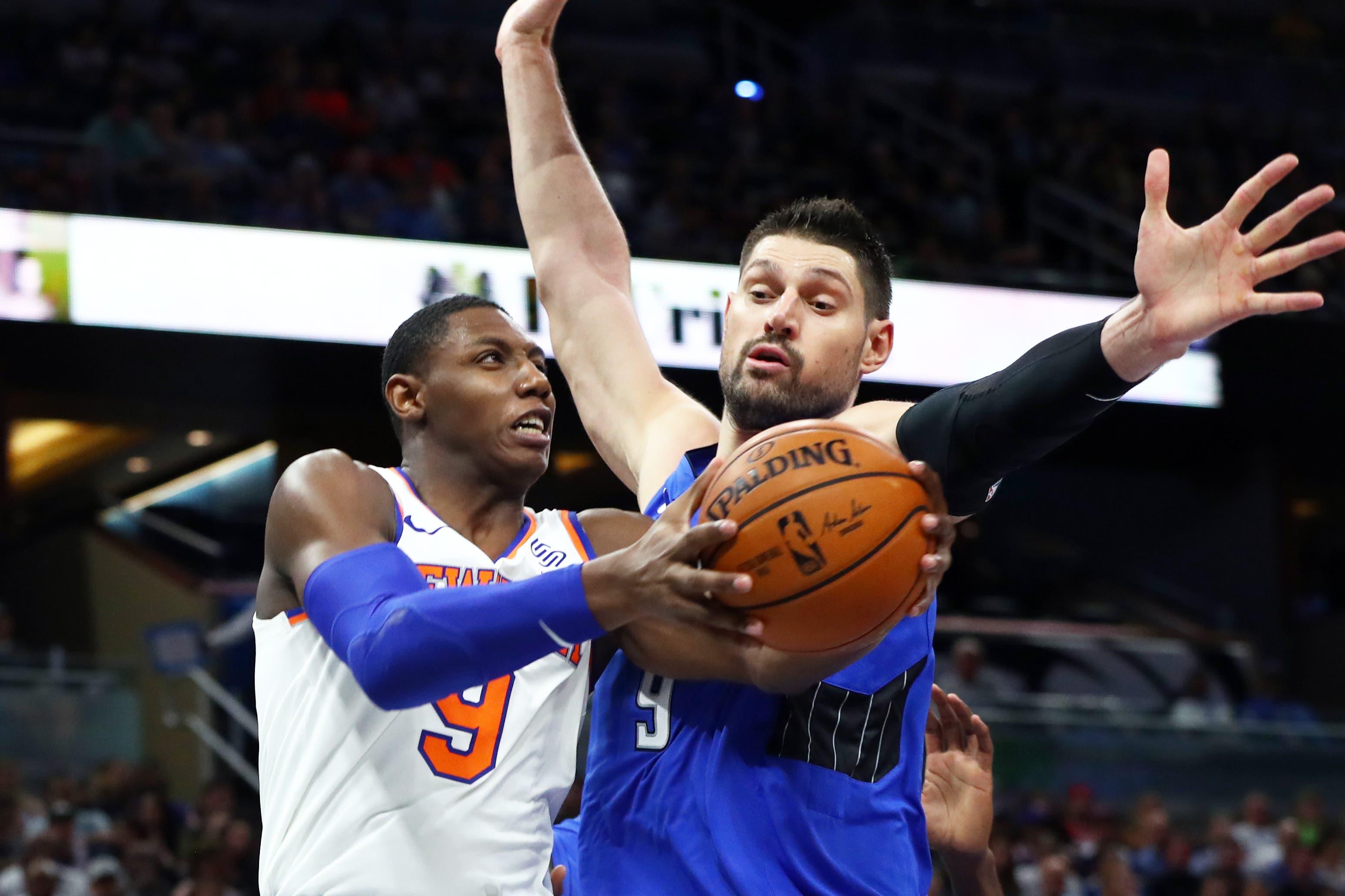 Oct 30, 2019; Orlando, FL, USA; New York Knicks forward RJ Barrett (9) drives to the basket as Orlando Magic center Nikola Vucevic (9) defends during the second quarter at Amway Center. Mandatory Credit: Kim Klement-USA TODAY Sports / Kim Klement