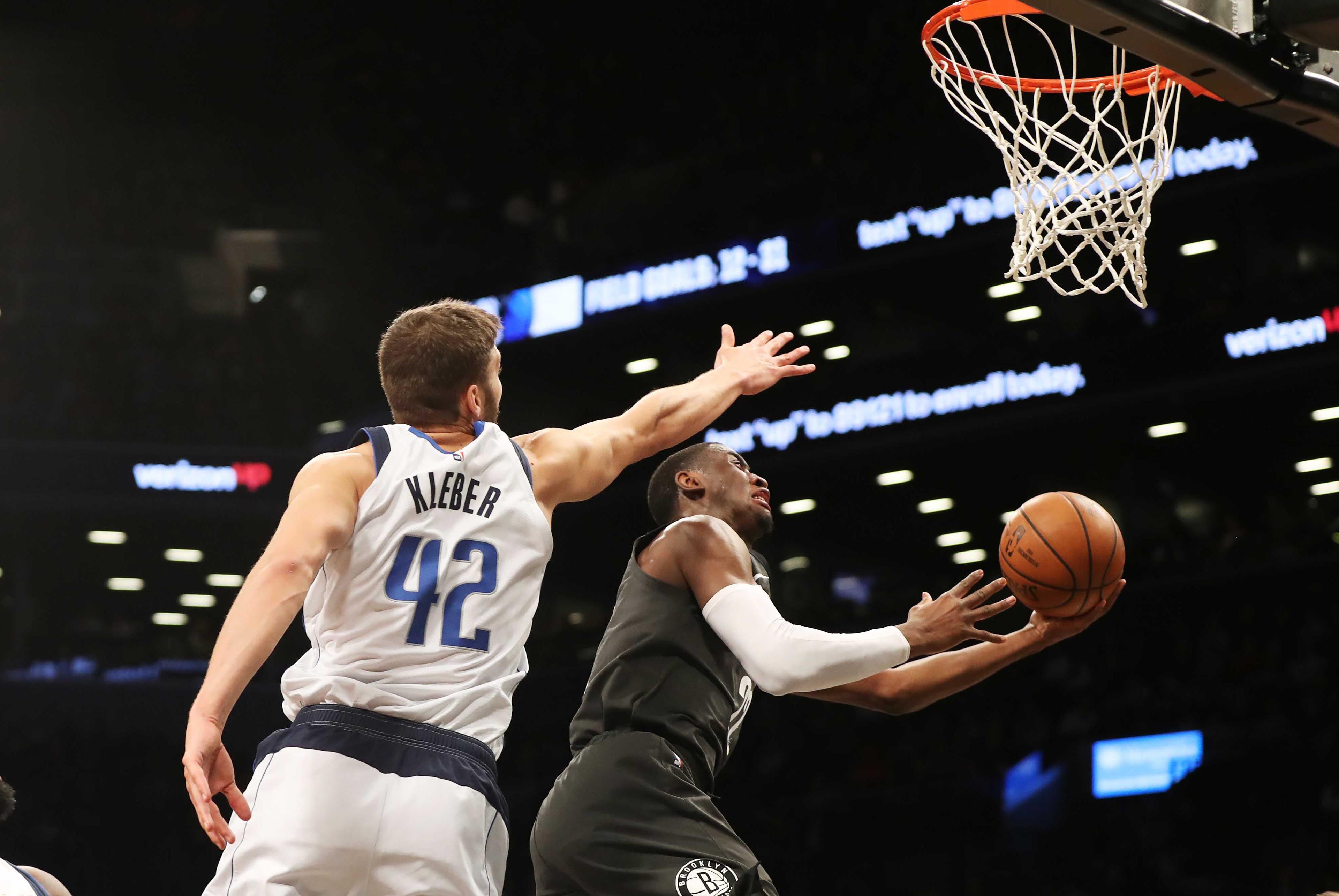 Brooklyn Nets guard Spencer Dinwiddie goes in for a shot against Dallas Mavericks forward Maximilian Kleber during the first half at Barclays Center. / Andy Marlin/USA TODAY Sports