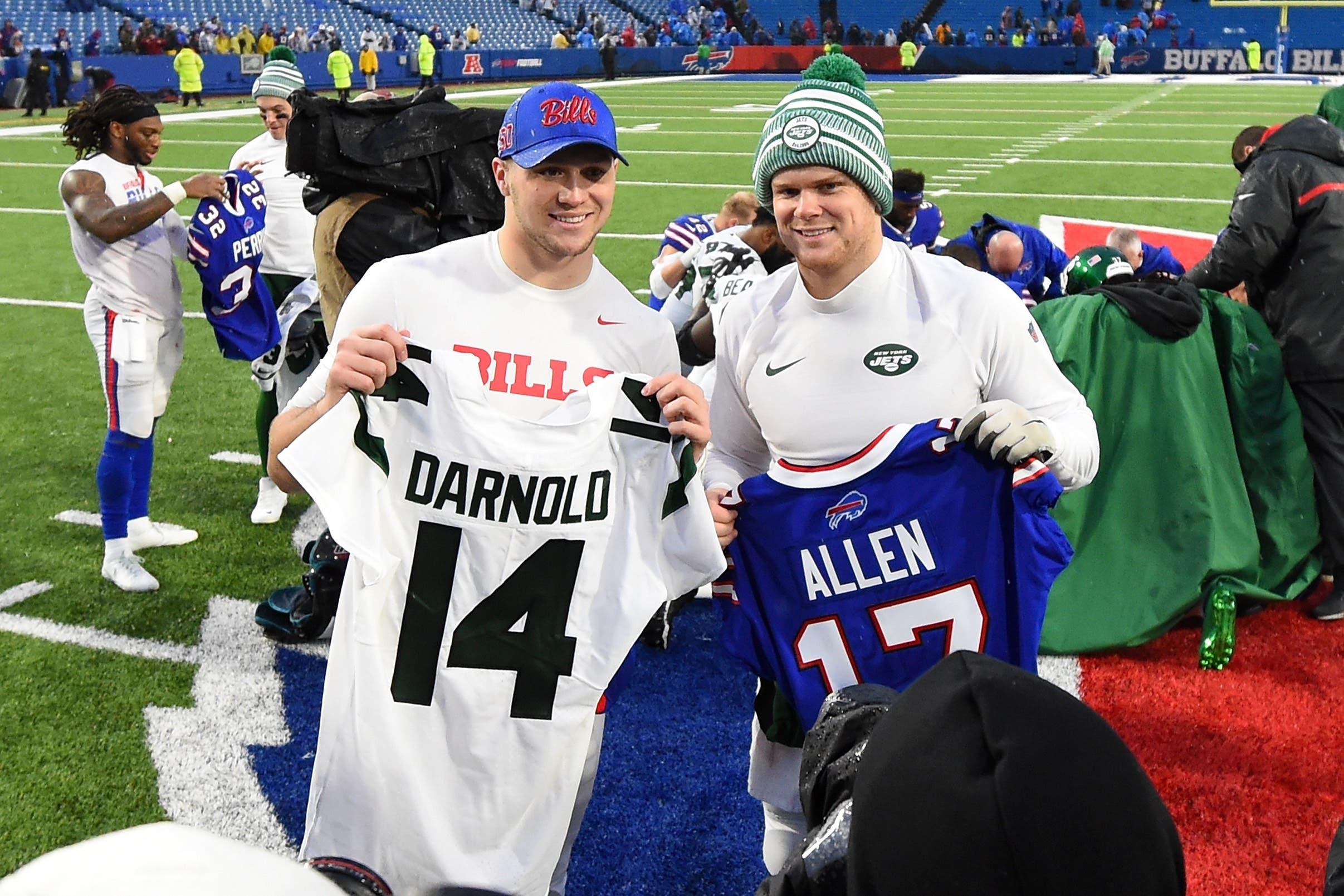 Dec 29, 2019; Orchard Park, New York, USA; New York Jets quarterback Sam Darnold (right) and Buffalo Bills quarterback Josh Allen (left) pose for a photo after a jersey exchange following the game at New Era Field. Mandatory Credit: Rich Barnes-USA TODAY Sports / Rich Barnes