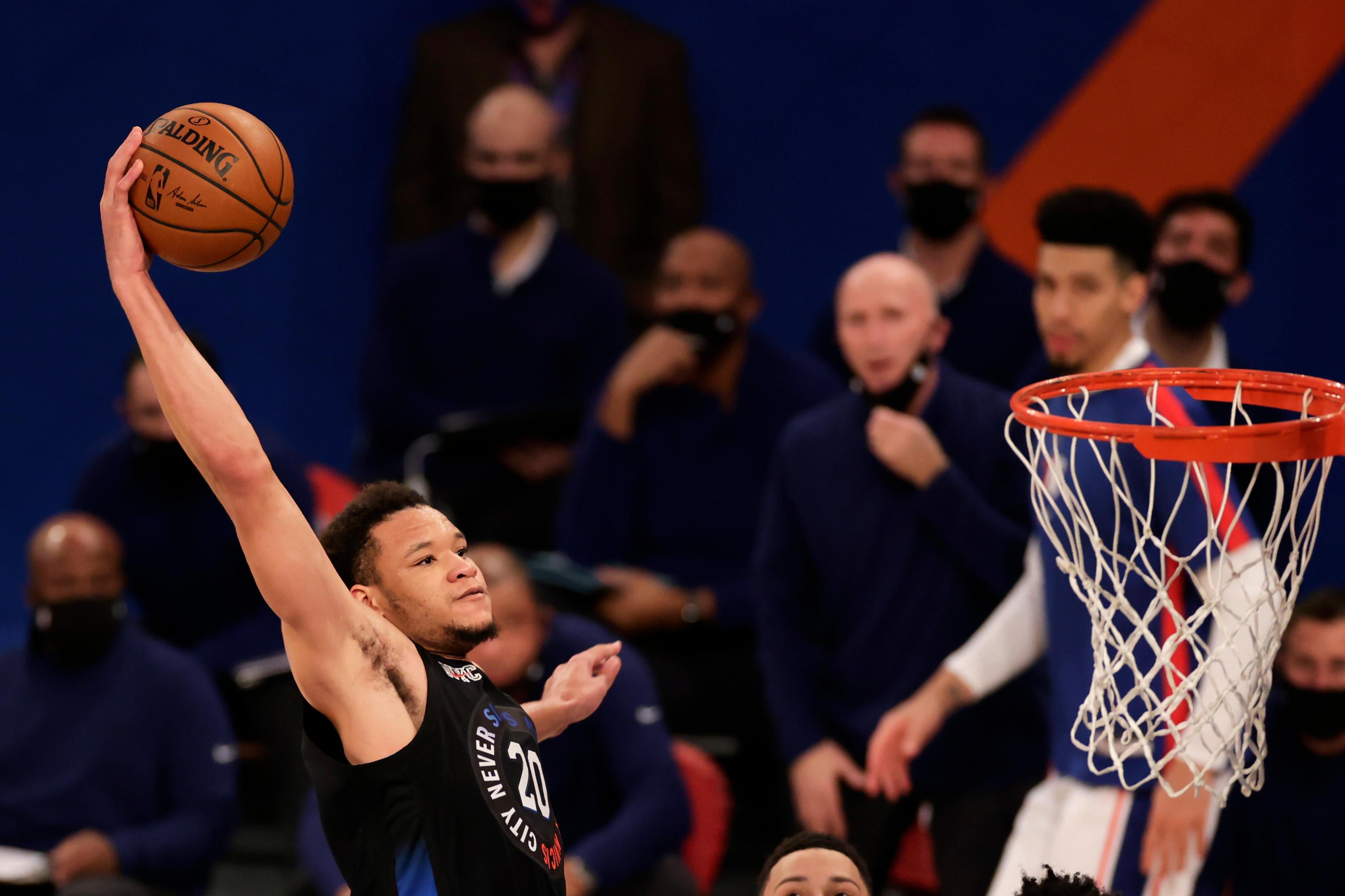 Dec 26, 2020; New York, New York, USA; New York Knicks forward Kevin Knox II slam dunks the ball during the second half of an NBA basketball game against the Philadelphia 76ers on Saturday, Dec. 26, 2020, in New York. The 76ers defeated the Knicks 109-89 at Madison Square Garden. Mandatory Credit: Adam Hunger/Pool Photo-USA TODAY Sports / © POOL PHOTOS-USA TODAY Sports