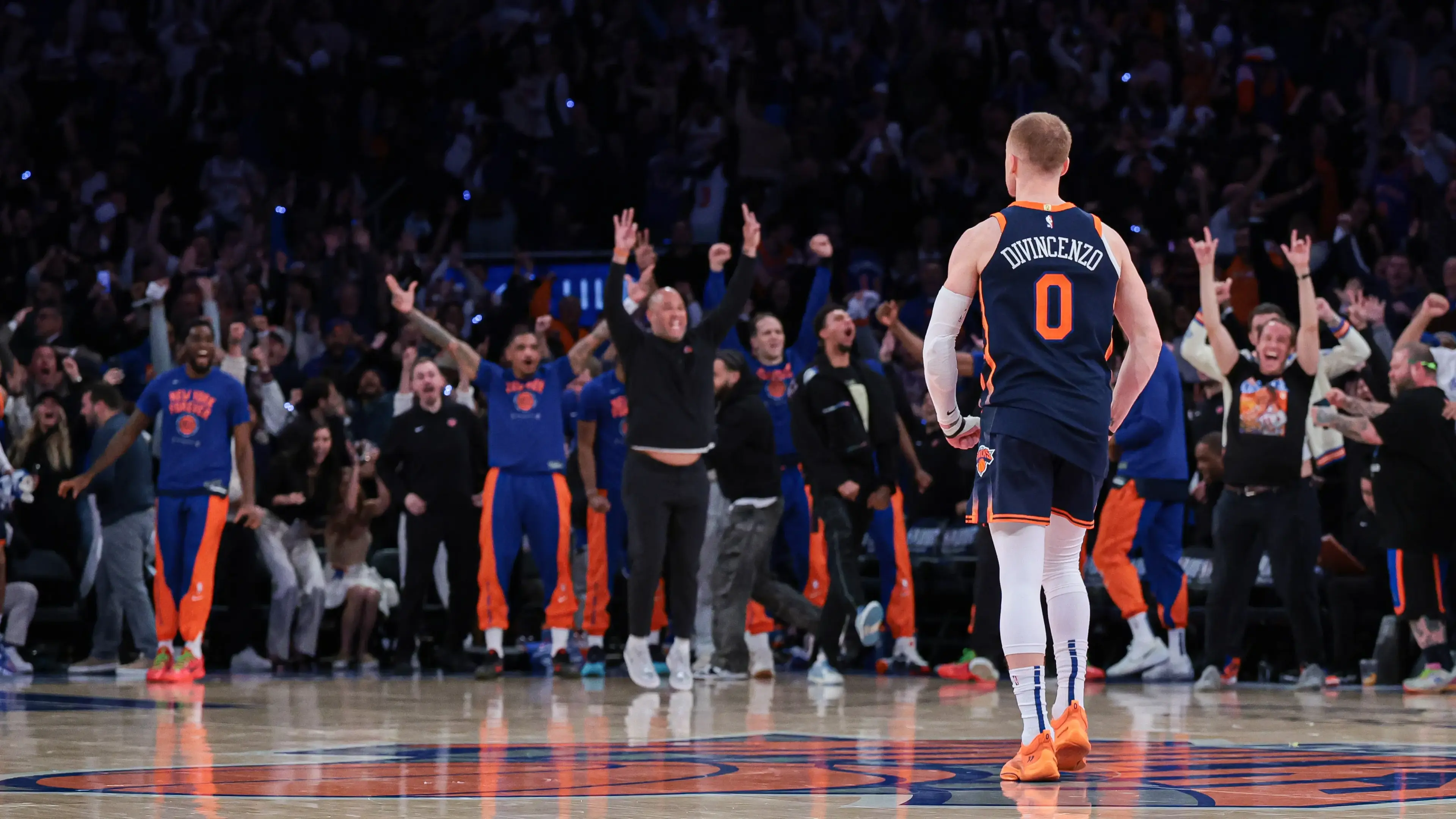 Apr 22, 2024; New York, New York, USA; New York Knicks guard Donte DiVincenzo (0) reacts after making a three point basket during the fourth quarter during game two of the first round for the 2024 NBA playoffs against the Philadelphia 76ers at Madison Square Garden. / Vincent Carchietta - USA TODAY Sports