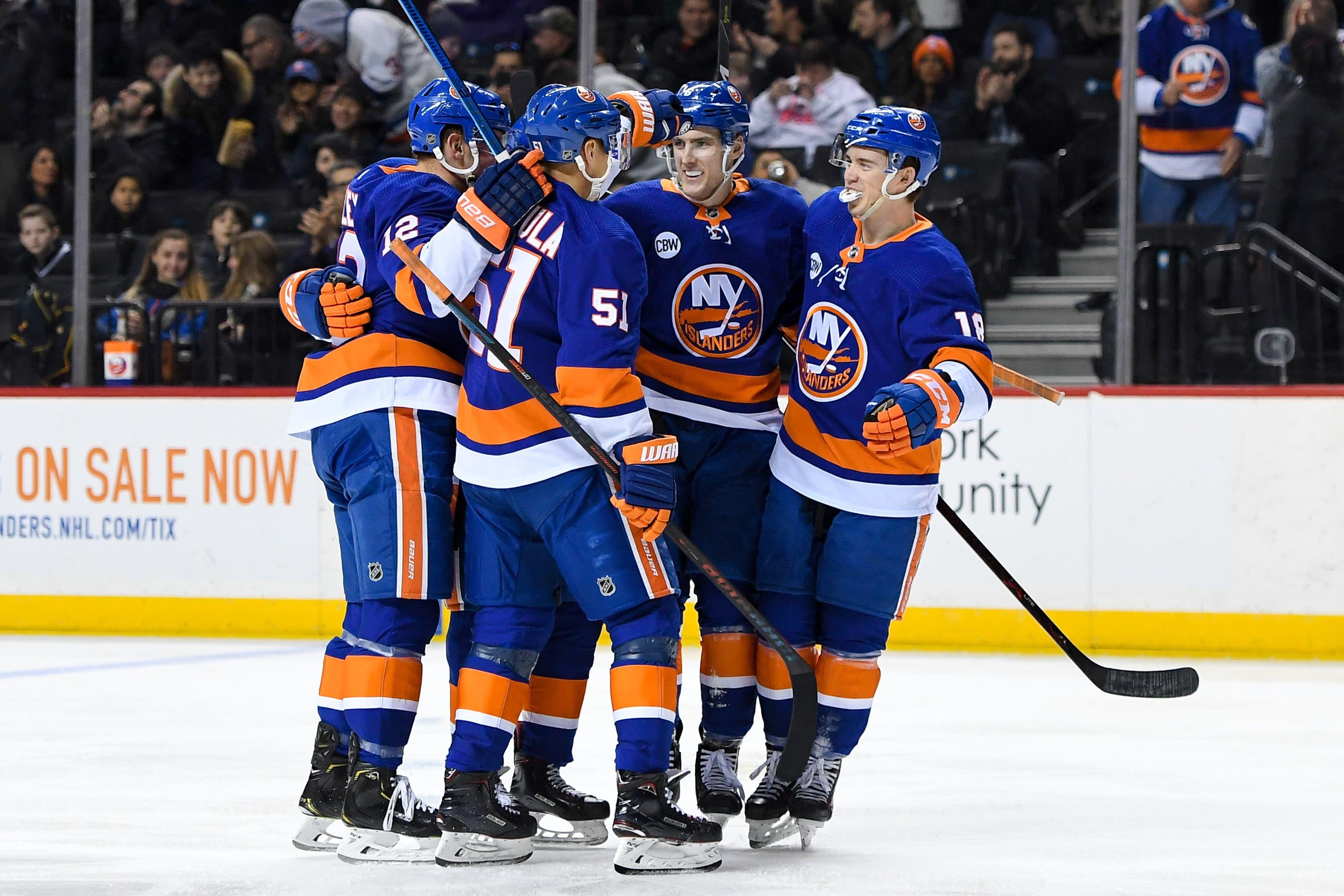 New York Islanders defenseman Devon Toews celebrates with teammates after scoring a goal against the Minnesota Wild during the second period at Barclays Center. / Dennis Schneidler/USA TODAY Sports