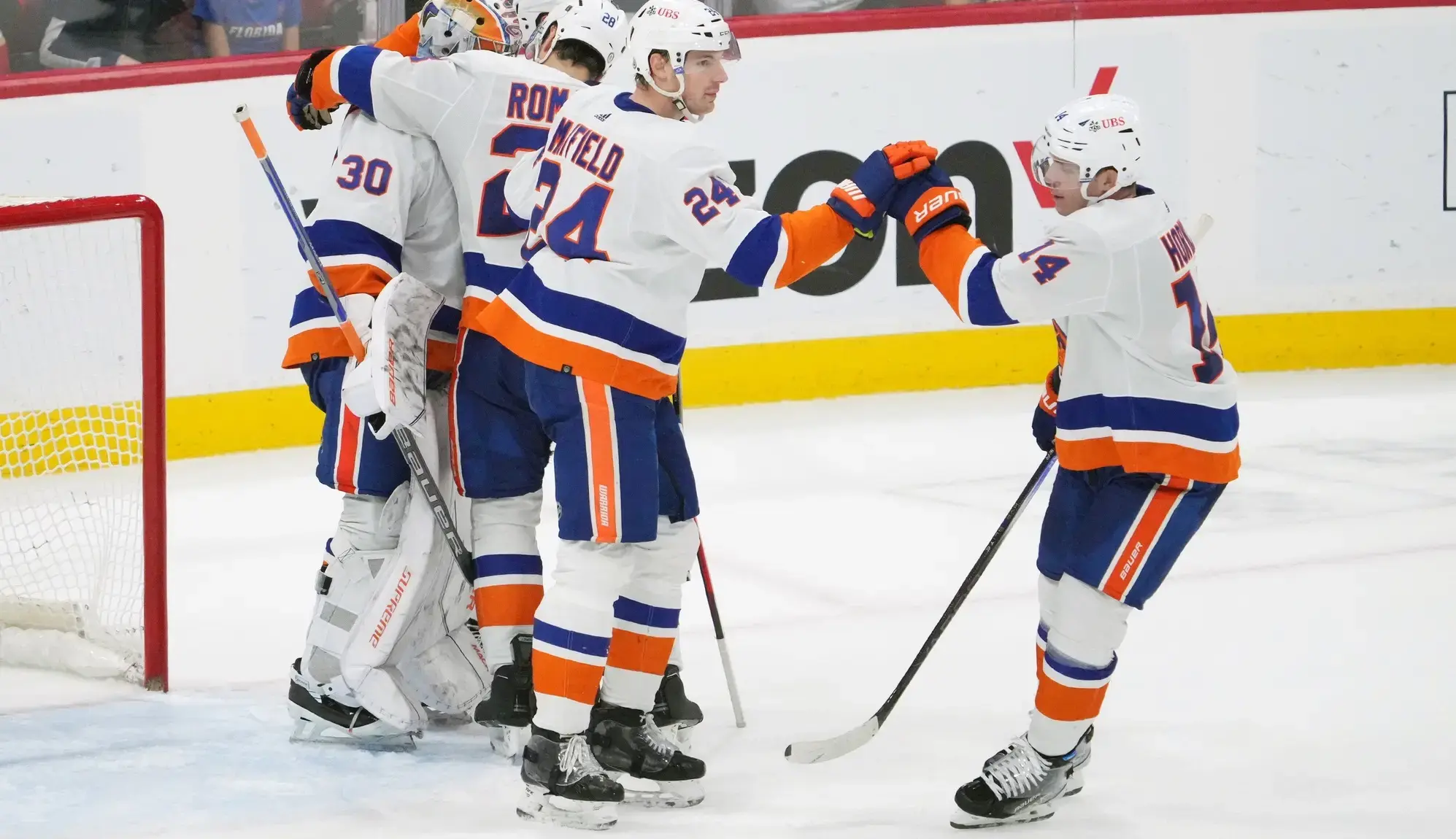 New York Islanders teammates celebrate after defeating the Florida Panthers at Amerant Bank Arena. / Jasen Vinlove-USA TODAY Sports